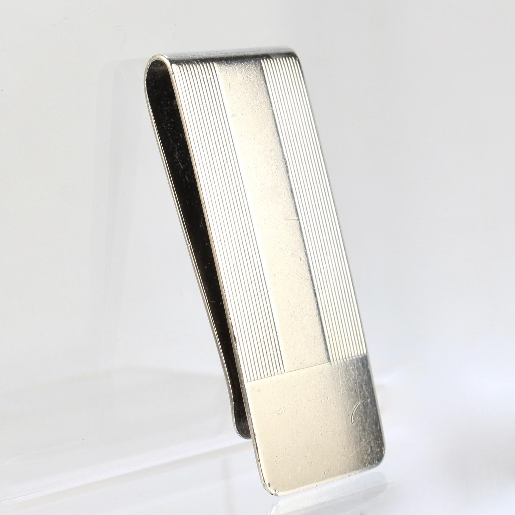 A very fine Tiffany & Co. money clip.

In sterling silver.

With fine linear engraved decoration.

A great everyday Tiffany piece!

Date:
20th Century

Overall Condition:
It is in overall fair, as-pictured, used estate condition.

Condition
