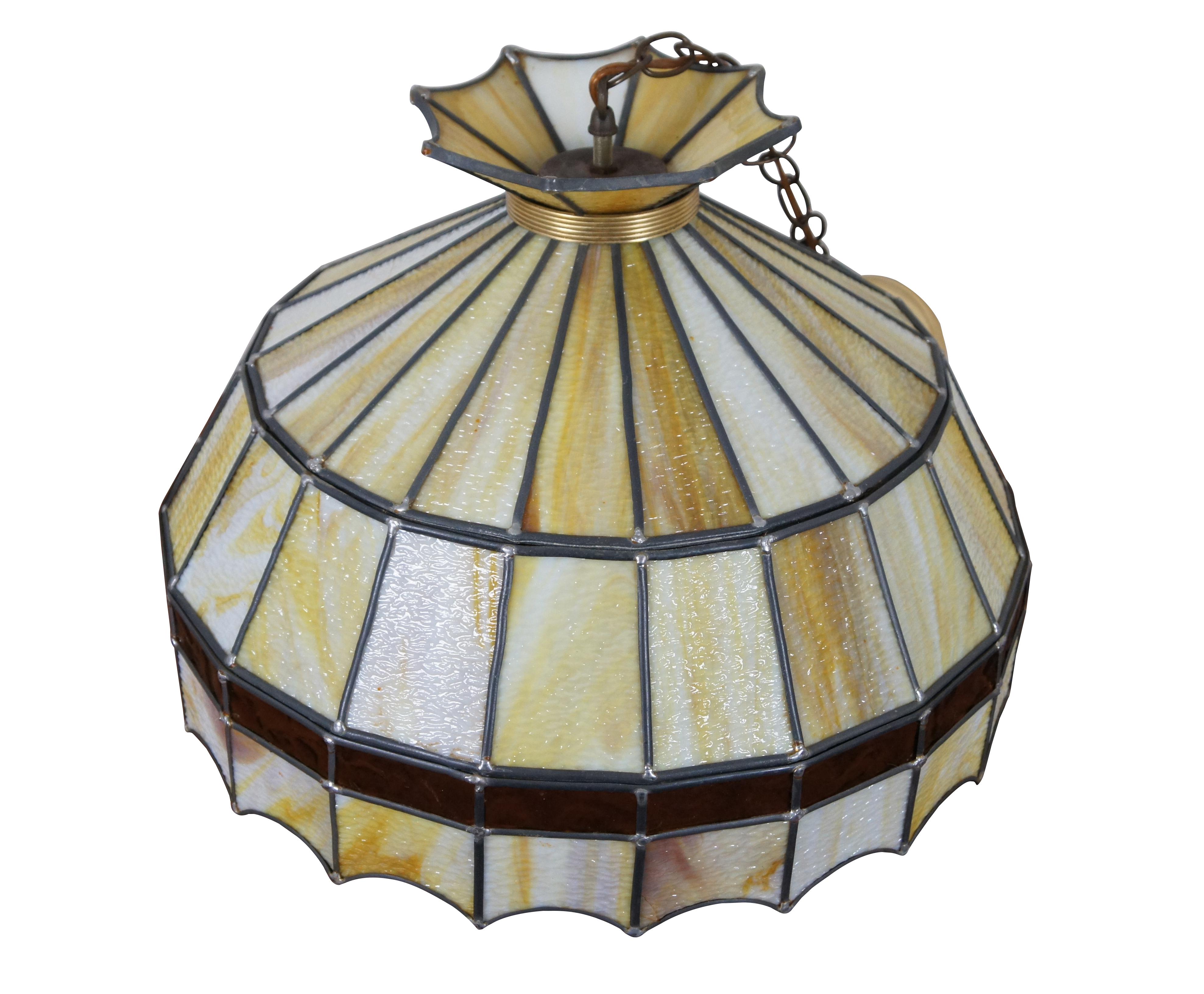 Vintage Tiffany style swag / pendant light / chandelier crafted of leaded yellow and cream slag glass panels with a band of amber stained glass above the scalloped lower edge.

Measures: 19.75” x 13” / Chain Length – 16” (Diameter x Height).
