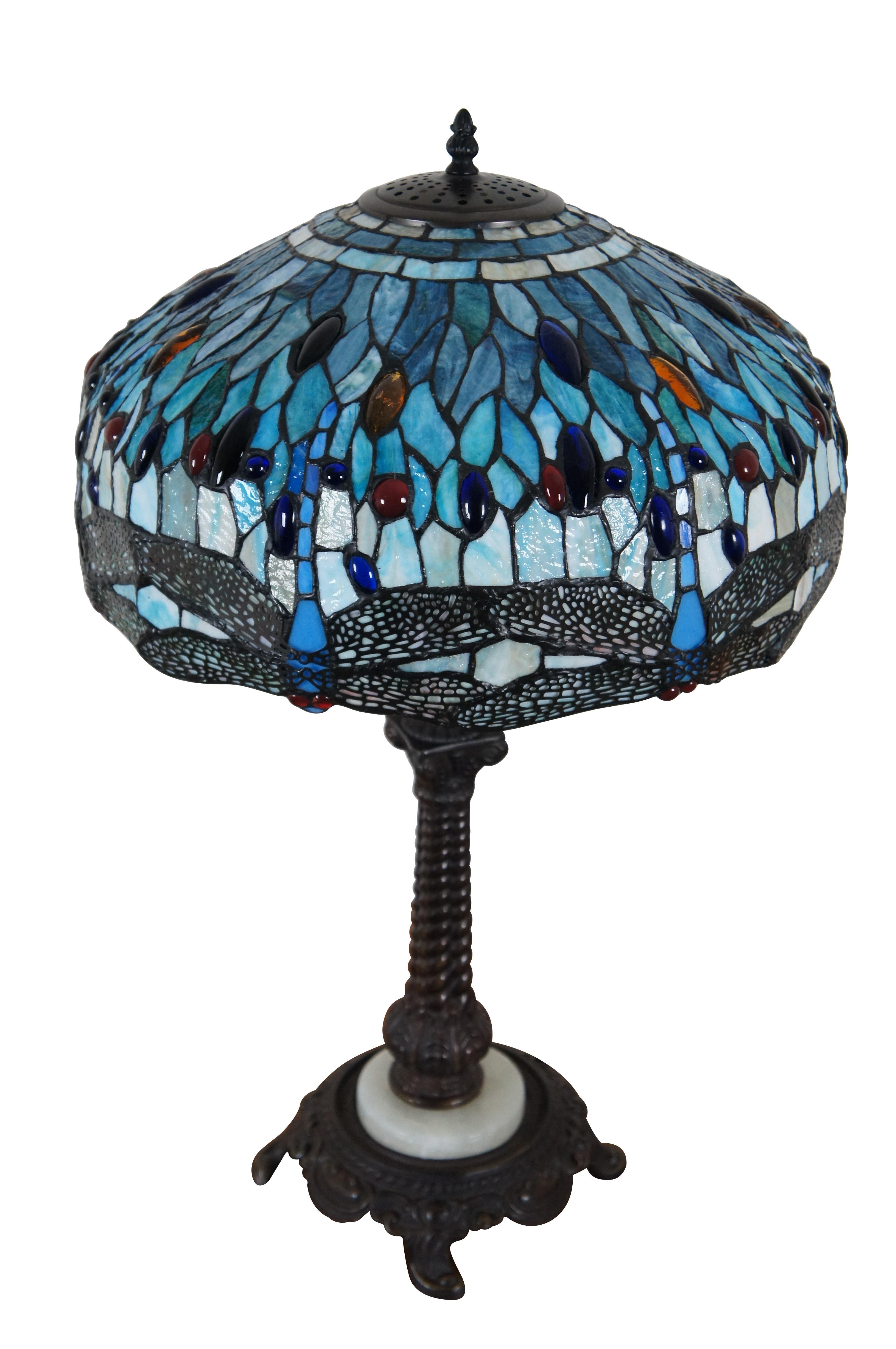 Vintage Tiffany style three light parlor table lamp.  Made of stained glass featuring Art Nouveau styling with a Dragonfly shade and Corinthian column acanthus base accented with stone.

Dimensions:
17” x 28” (Diameter x Height)