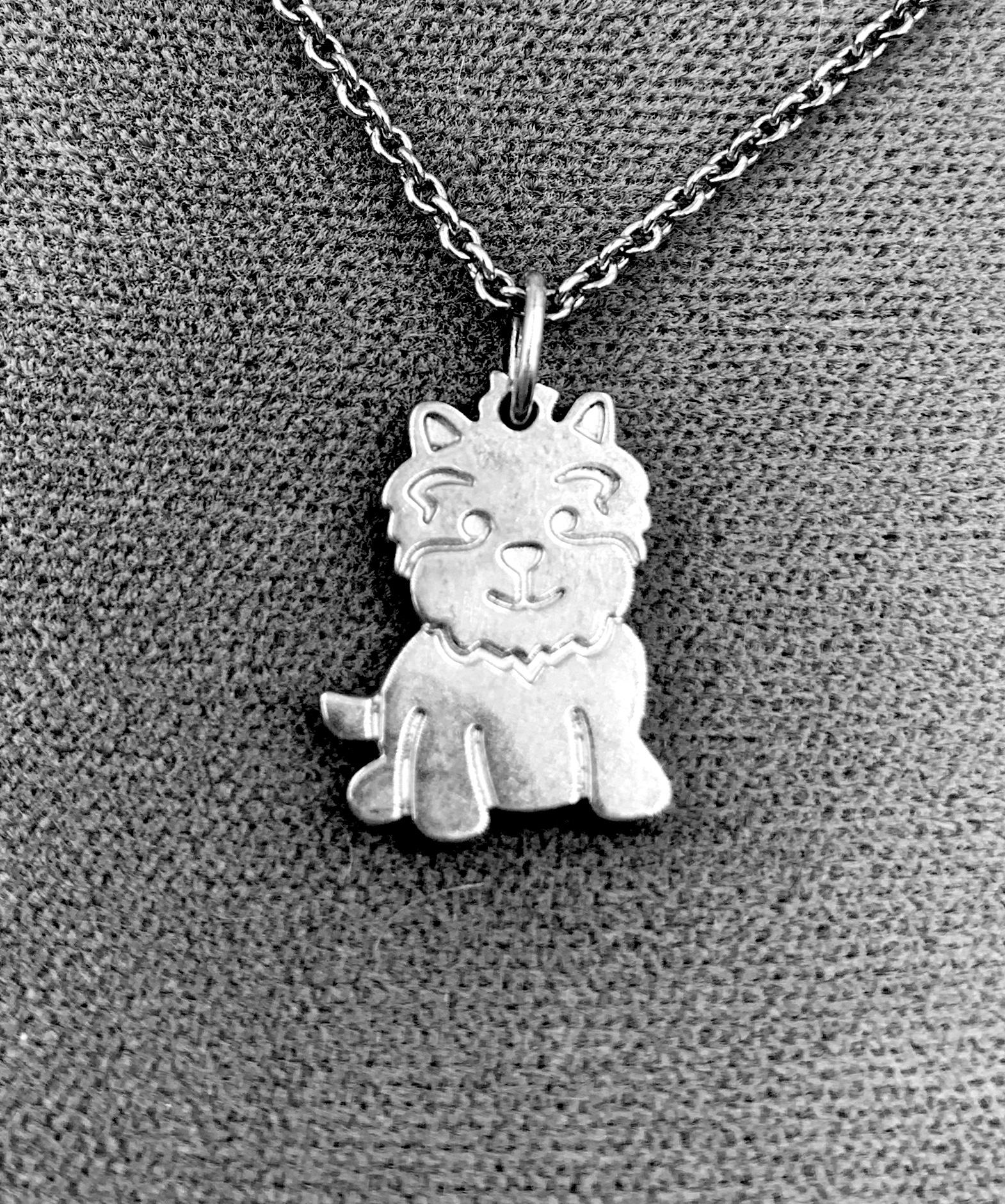 Charming and unusual vintage Tiffany pendant necklace of an adorable West Highland White Terrier. The pendant marked on back T&Co., AG925, NEW and chain marked Tiffany & Co., AG925. This necklace is in very good overall vintage condition. Chain is