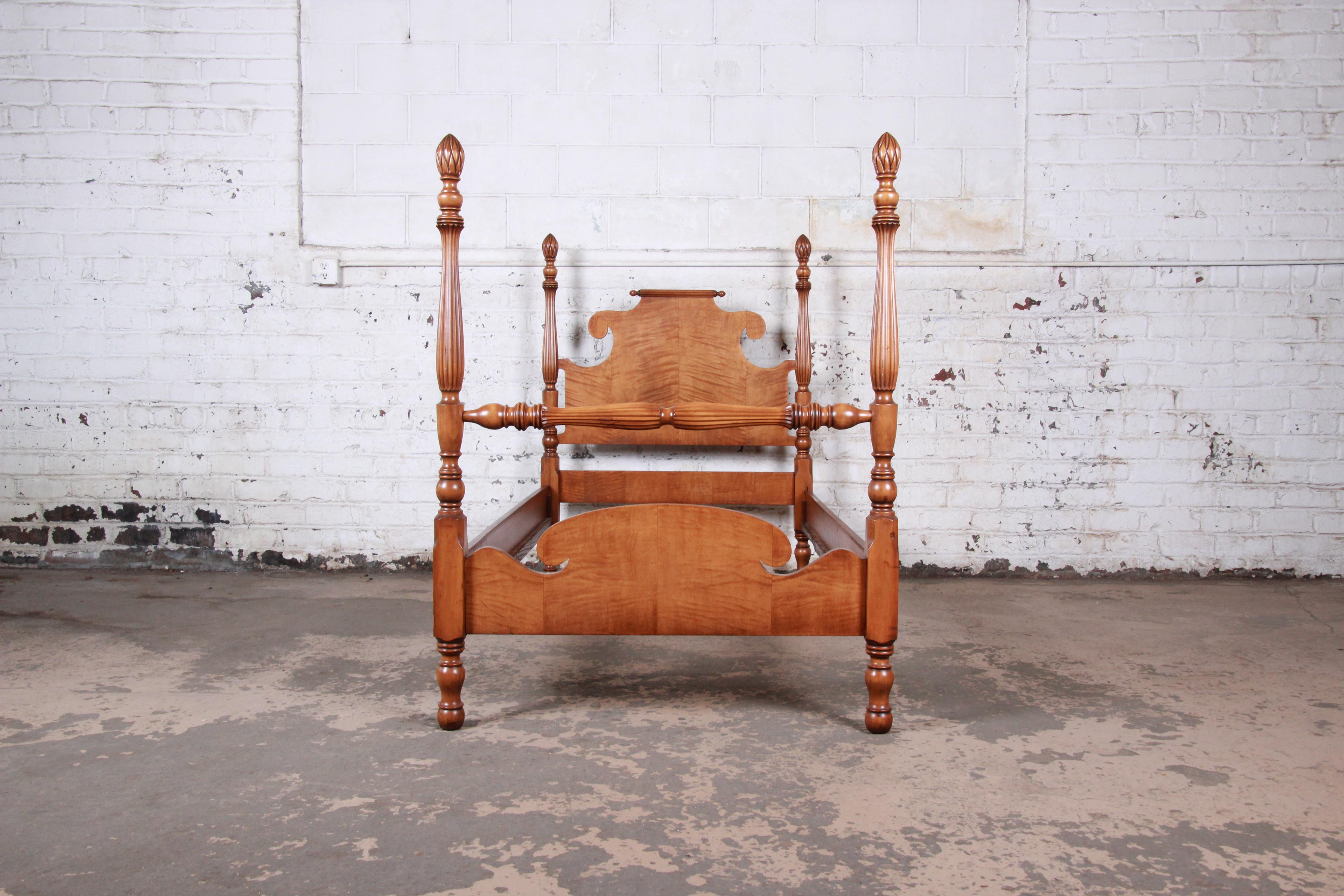 A gorgeous carved tiger maple twin size pineapple poster bed

USA, circa 1950s

Measures: 41.5