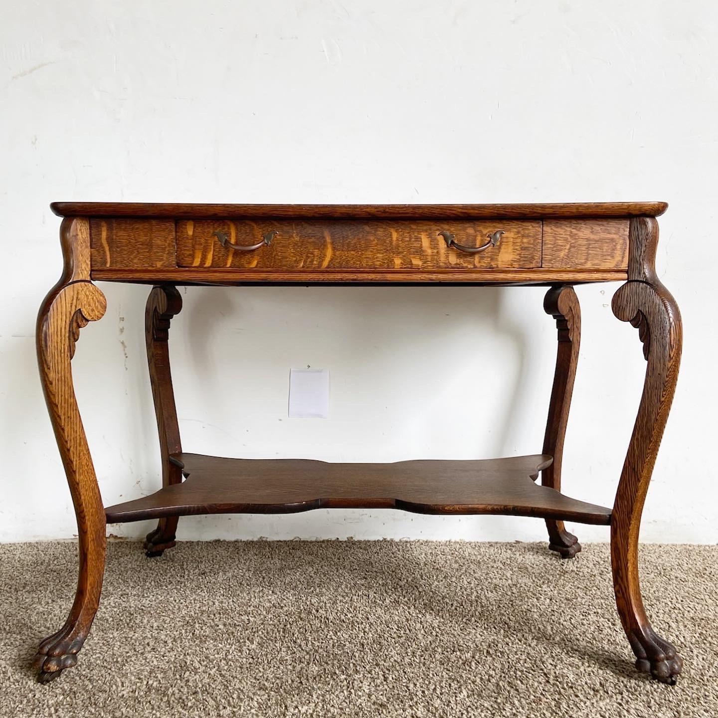 Introducing our Vintage Tiger Oak Console Table/Desk, a fusion of function, elegance, and vintage charm, featuring a unique grain and a central drawer.

Crafted from striking Tiger Oak, showcasing a warm, rich grain and distinctive stripes.
Features