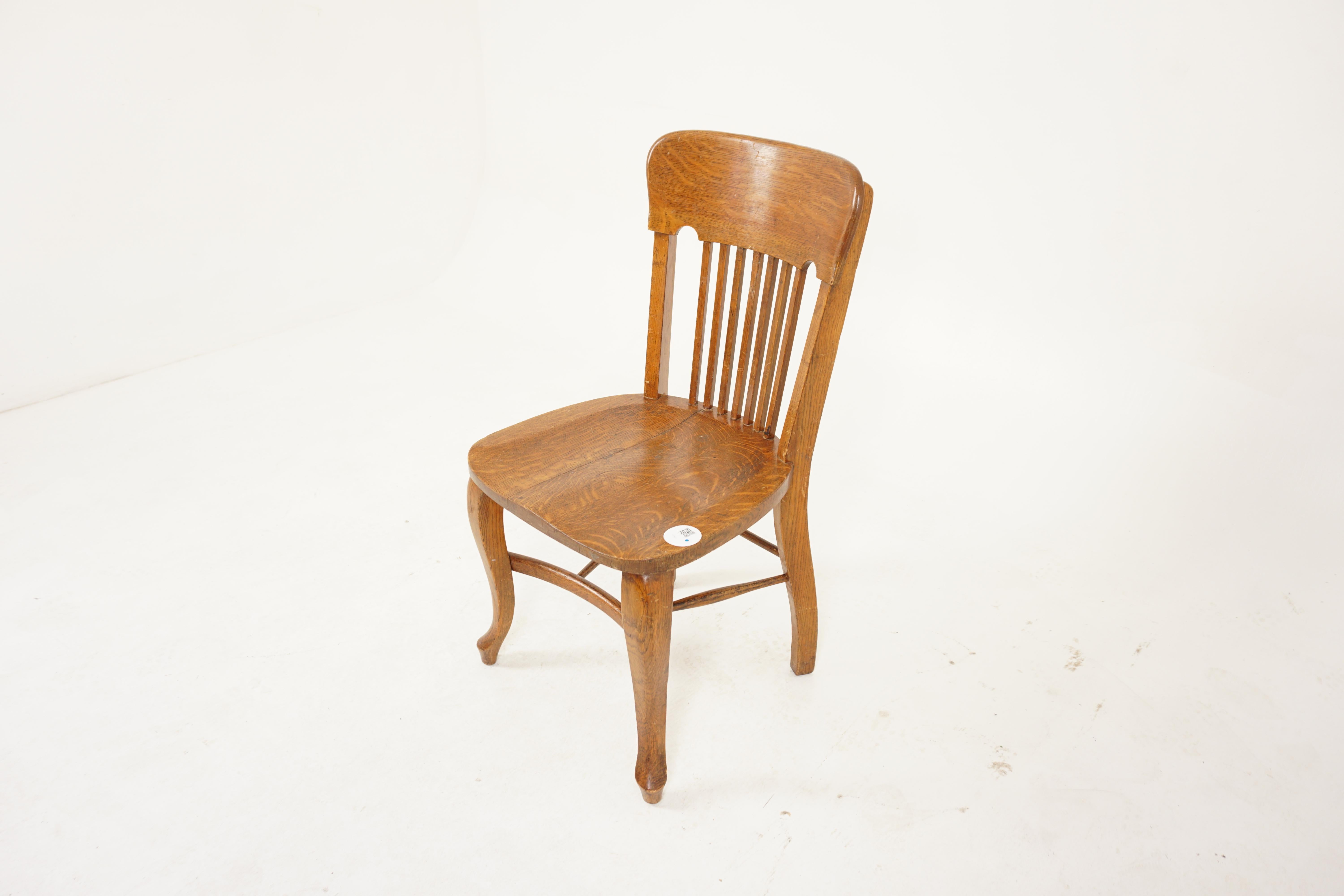 Vintage Tiger Oak office chair, American 1920, H921

American 1920
Solid oak
Original finish
Carved top rail
Seven vertical slats below
Solid Tiger oak saddle seat
All standing on shaped cabriole front legs
Connected by turn stretchers
