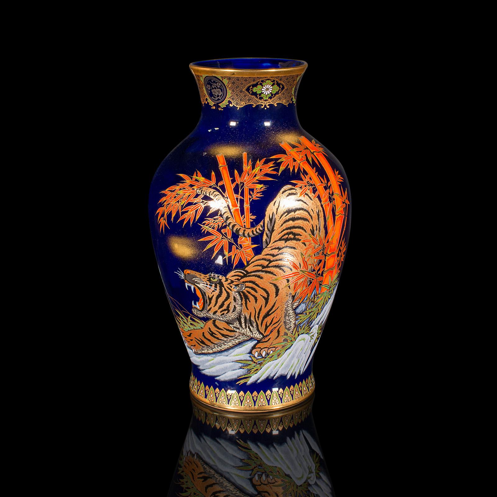 This is a vintage tiger vase. A Chinese, lacquer ceramic baluster urn, dating to the late 20th century, circa 1980.

Striking motif accentuates this generously sized vase
Displays a desirable aged patina and in good order
Appealing blue lacquer