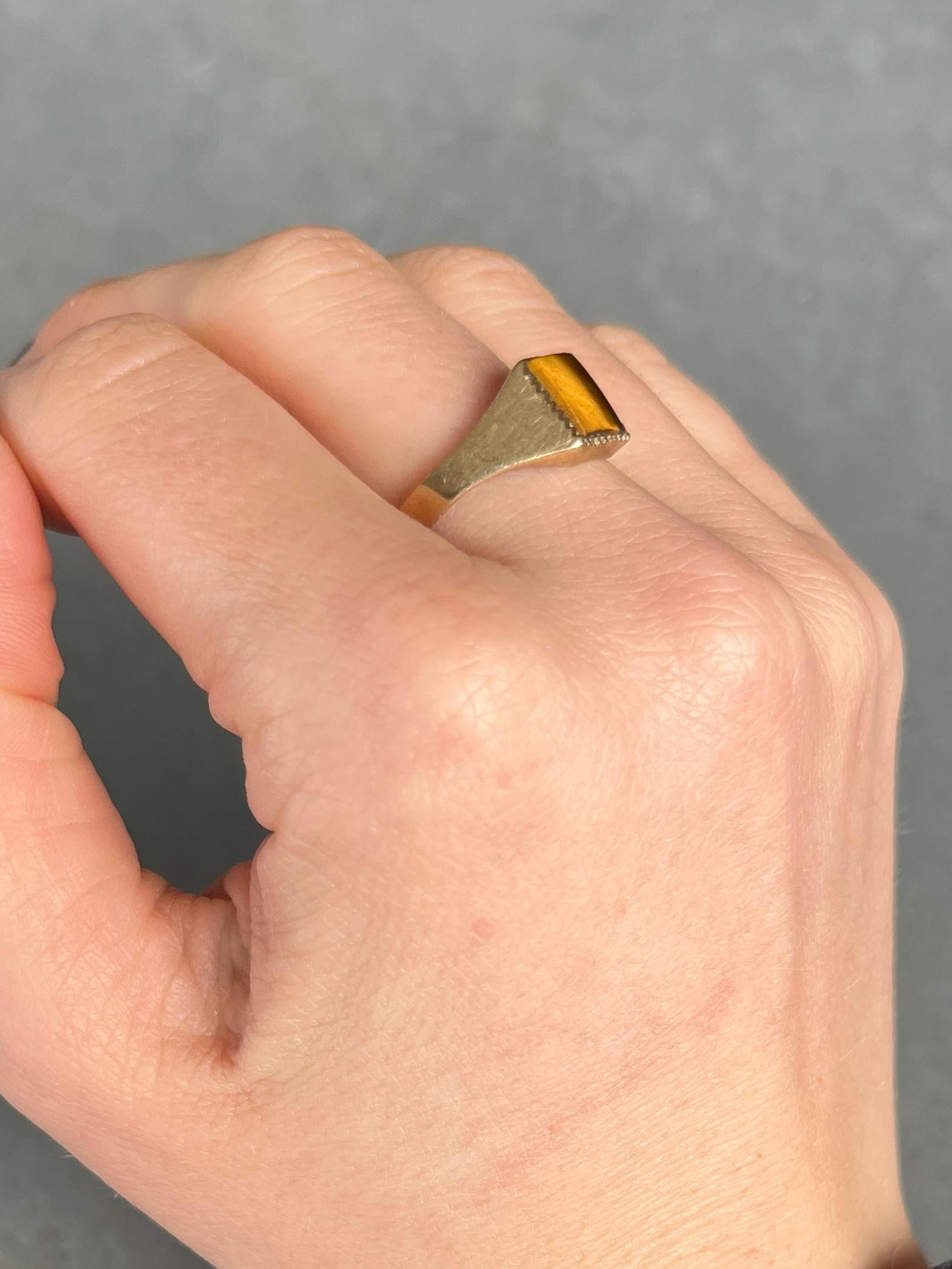 This tigers eye stone is truly mesmerising. They give the classic brown colour with fine stripes of darker brown running through it. The setting is modelled in 9ct gold. Hallmarked London 1979.

Size: Q 1/2 or 8 1/2 
Face Dimensions: 6x8mm 

Weight:
