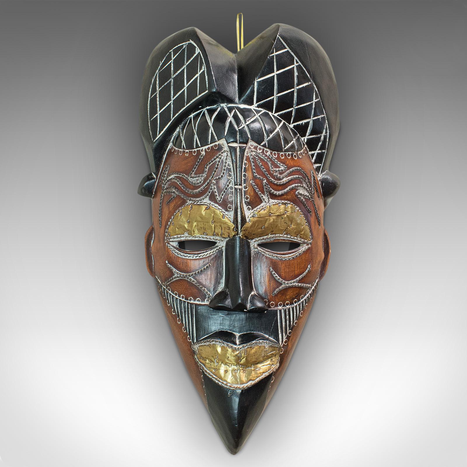 This is a vintage Tikar tribal mask of Cameroon. An African, tropical hardwood ceremonial mask, dating to the 20th century, circa 1970.
 
Appealing tribal mask from Cameroon
Displays a desirable aged patina
Carved from tropical hardwood with