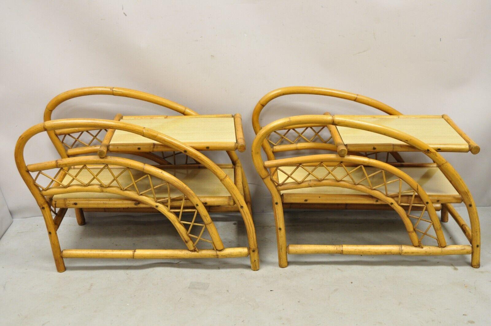Vintage Tiki Rattan Bentwood Bamboo 2 Tier Scultpural End Tables - a Pair. Item features (2) tier laminate surfaces, shapely bentwood bamboo frames, very nice vintage pair, sleek sculptural form. 
Circa Mid 20th Century.
Measurements: 
Overall: