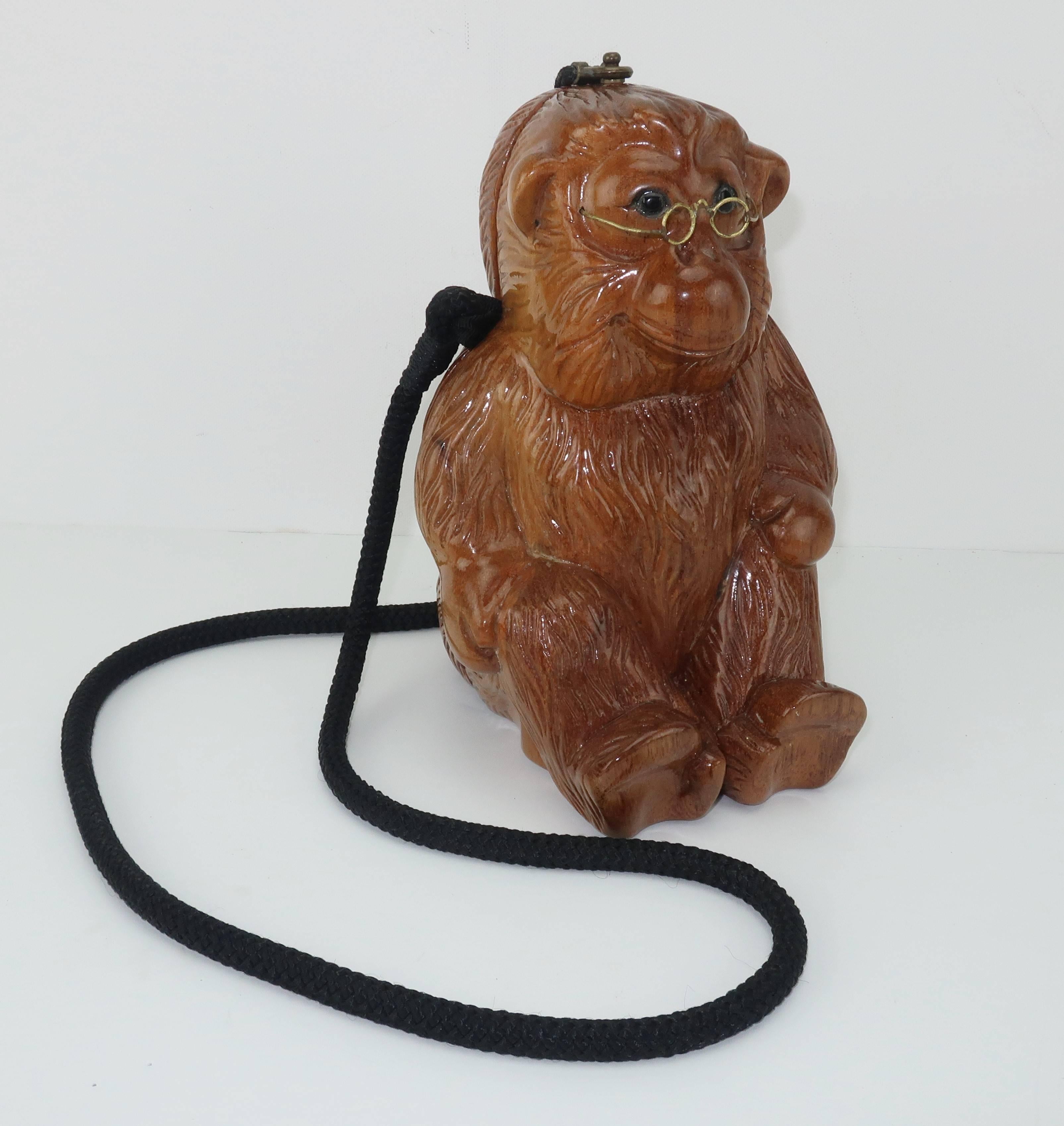 Witty ... whimsical ... wearable art ... AND wooden!  This vintage Timmy Woods of Beverly Hills carved wood monkey handbag is sure to bring a smile.  The little guy is in a seated position with intricate carving which replicates fur.  He is also