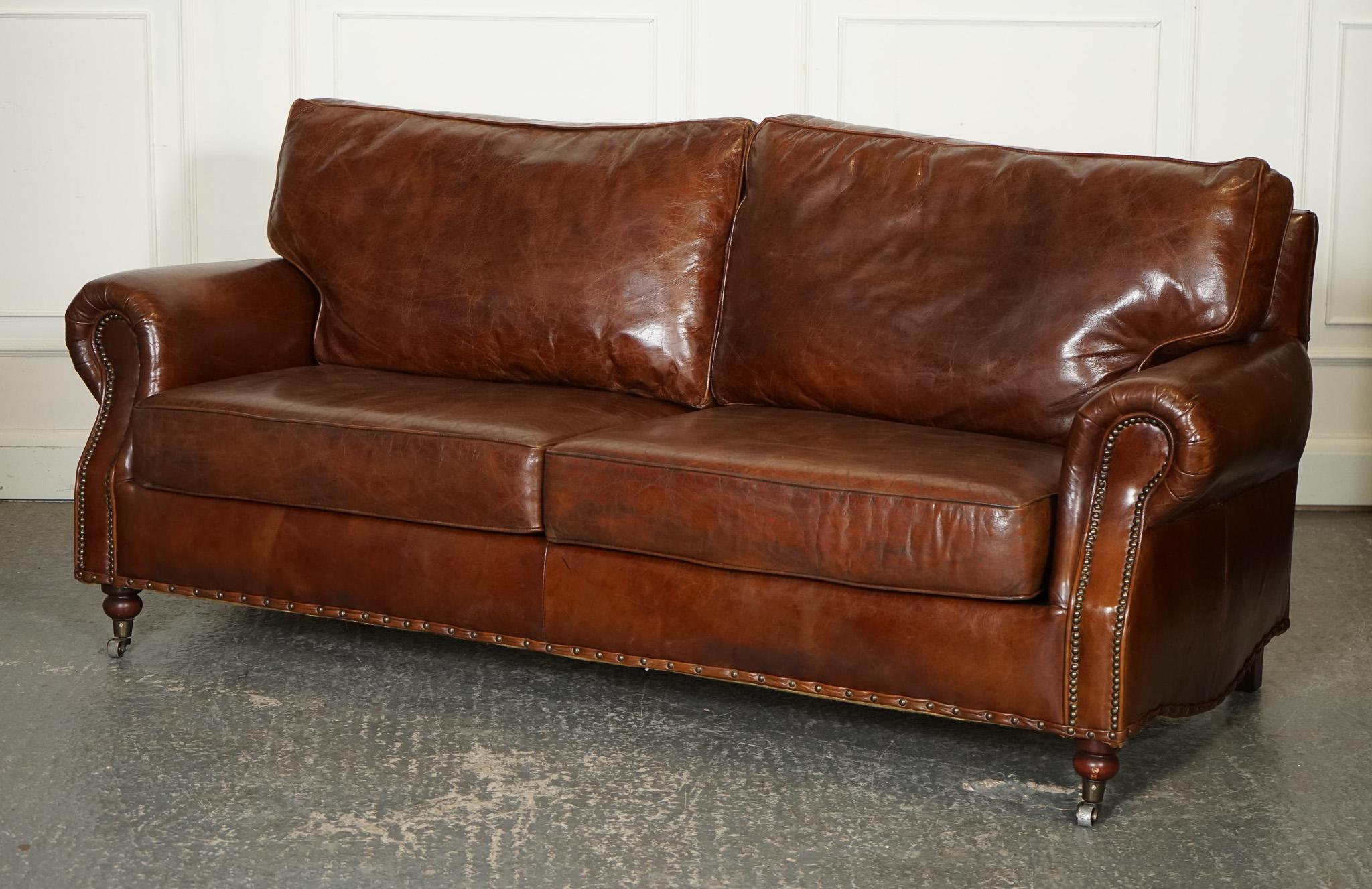 
We are delighted to offer for sale this Vintage Timothy Oulton Halo Balmoral Brown Leather Two to Three Seater Sofa.

 A stunning piece of furniture that exudes timeless elegance and luxurious comfort. Crafted with meticulous attention to detail