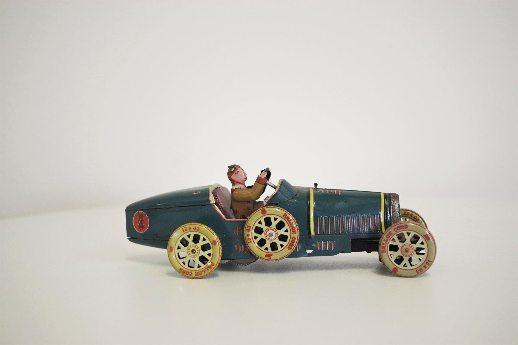 Vintage Tin Toy Car, 1990s - Retro Collectible Charm

Add a touch of nostalgia to your collection with this vintage tin car toy from the 1990s. Expertly crafted with intricate details, this retro toy car brings back the charm of traditional tin