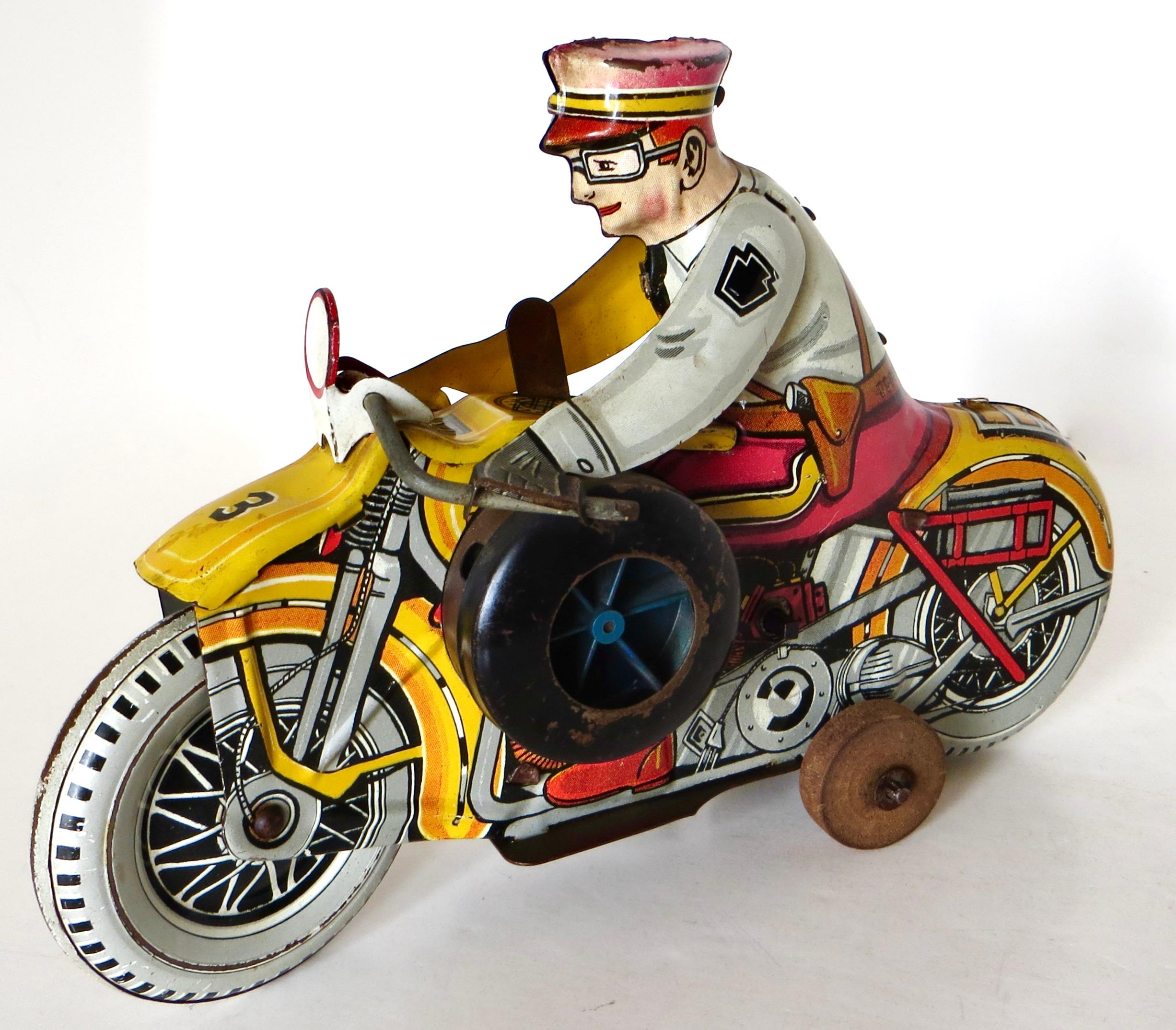 Arte popolare Giocattolo a vento di latta vintage di Louis Marx Toy Co. 