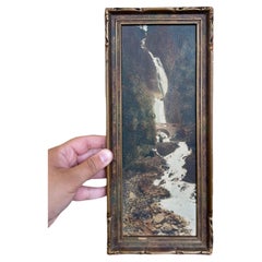 Vintage Tinted Landscape Photograph of Waterfall and Stone Bridge in Ornate