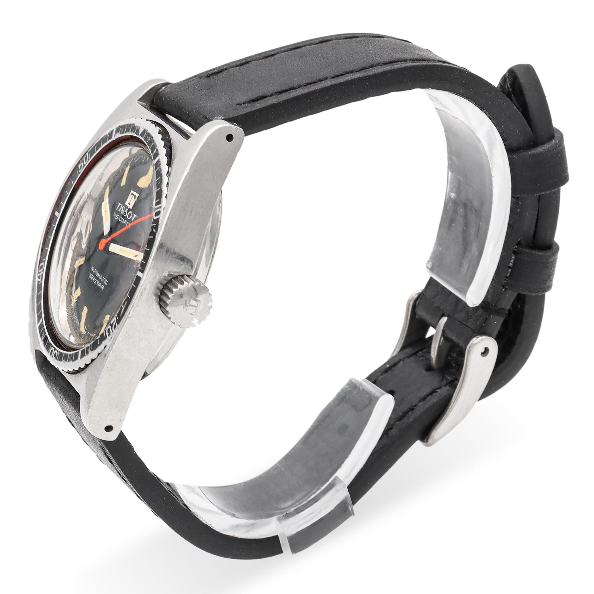 A robust TISSOT timepiece, featuring a black dial with luminous hour markers and a date indicator at 3 o'clock, encased in a stainless steel frame. The automatic movement ensures precision, while the black leather strap adds a touch of