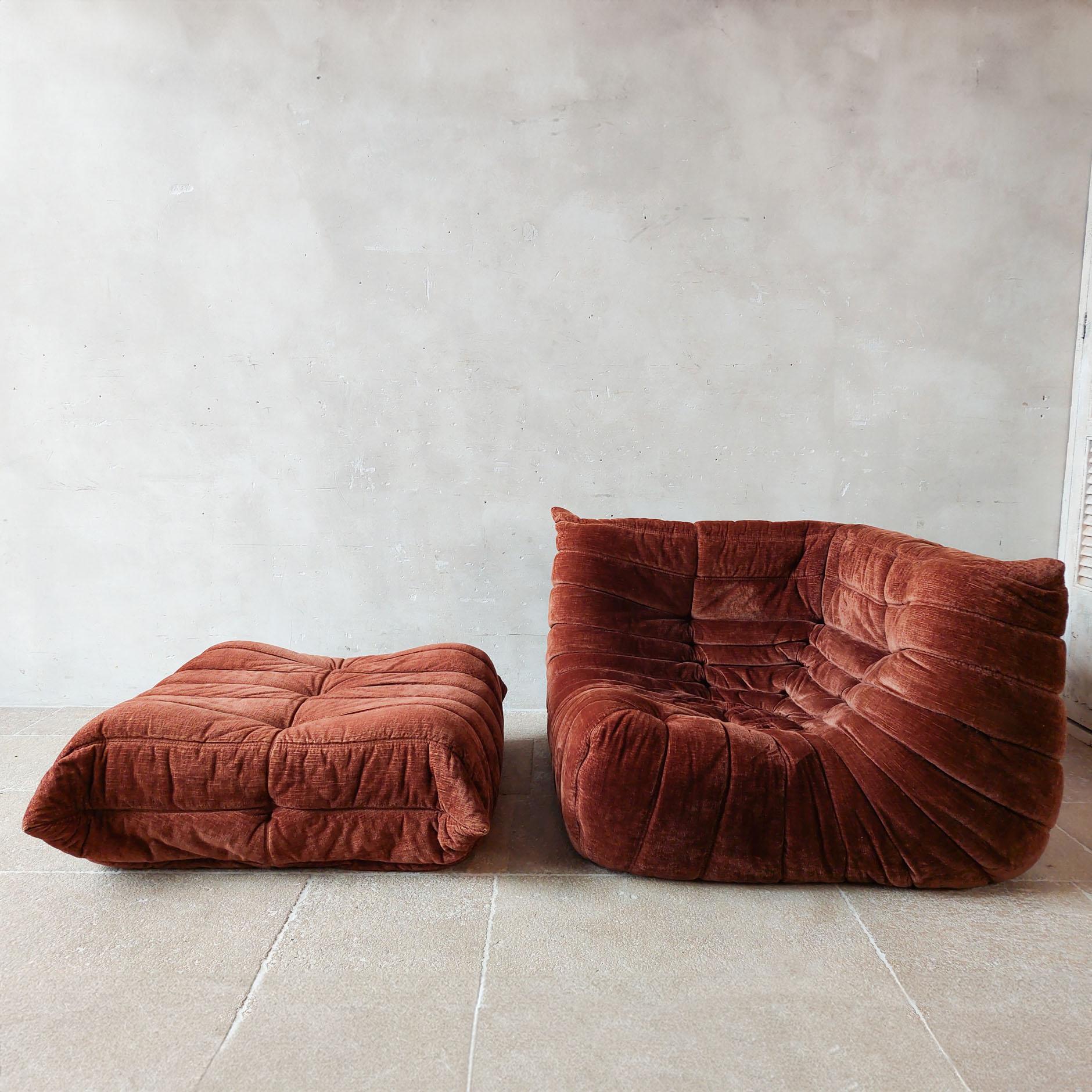 Vintage Togo sofa set, designed by Michel Ducaroy in the 1970s and manufactured by Ligne Roset in France. This iconic corner armchair with ottoman features original cognac brown velvet upholstery, embodying both timeless style and comfort.

Crafted