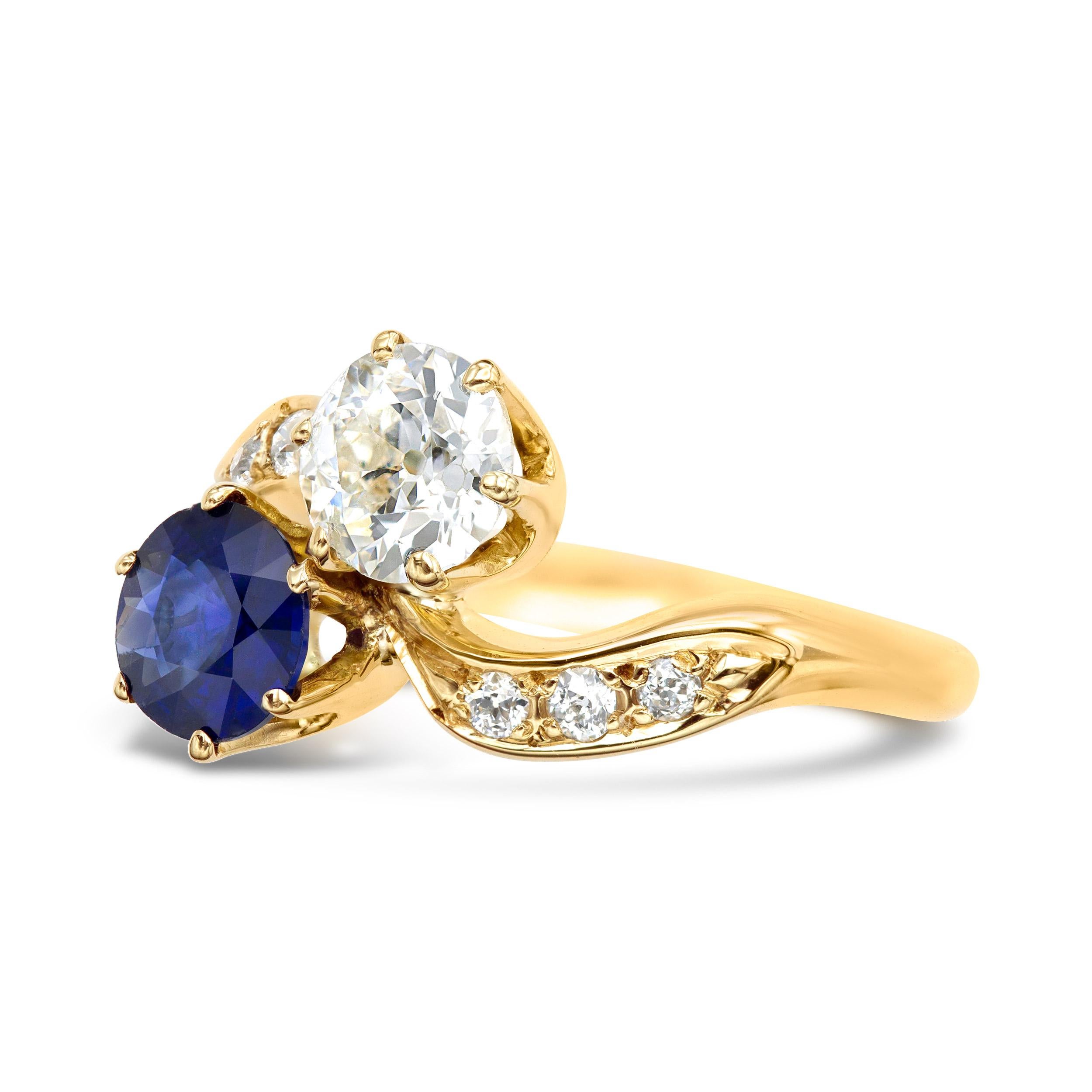 A darling toi et moi, dated back to the first half of the twentieth century, features a winning combination. The deep velvety blue sapphire is complimented by a super sweet old European cut diamond all set in a swirling 14 karat yellow gold setting.
