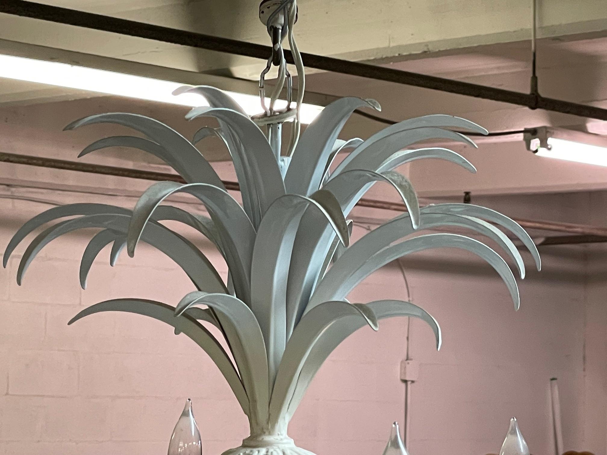Vintage tole metal chandelier features tropical pineapple design and tole metal construction. Good condition with minor imperfections consistent with age.