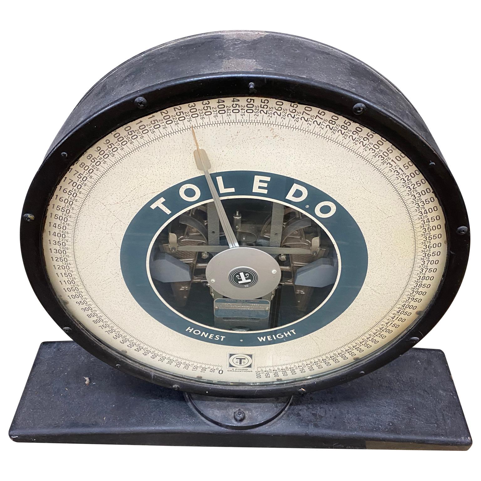 Post War Toledo Top of scale with 5,000 pound weight capacity. The story of Toledo Scale began when Henry Theobald was fired from the National Cash Register Company for instituting changes in the production system that he believed would decrease
