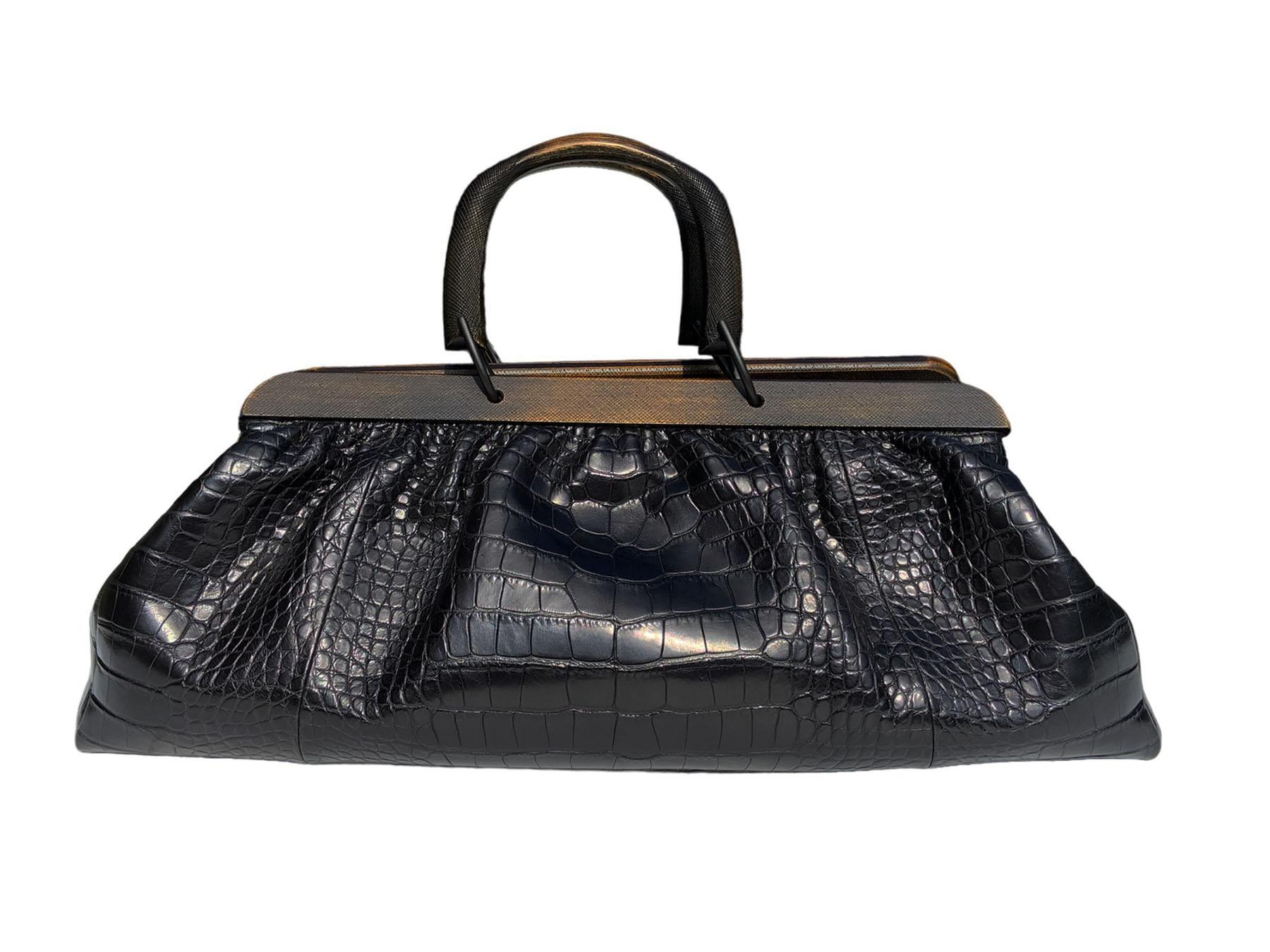 Outrageously gorgeous Gucci Doctors Large Bag! From none other, than the fabulous Tom Ford. 
Made of genuine crocodile skin. Two wood handles with 4'' drop. Closes with a belt on top. 
Lined in black leather. Hardware Matte Black. Interior has one