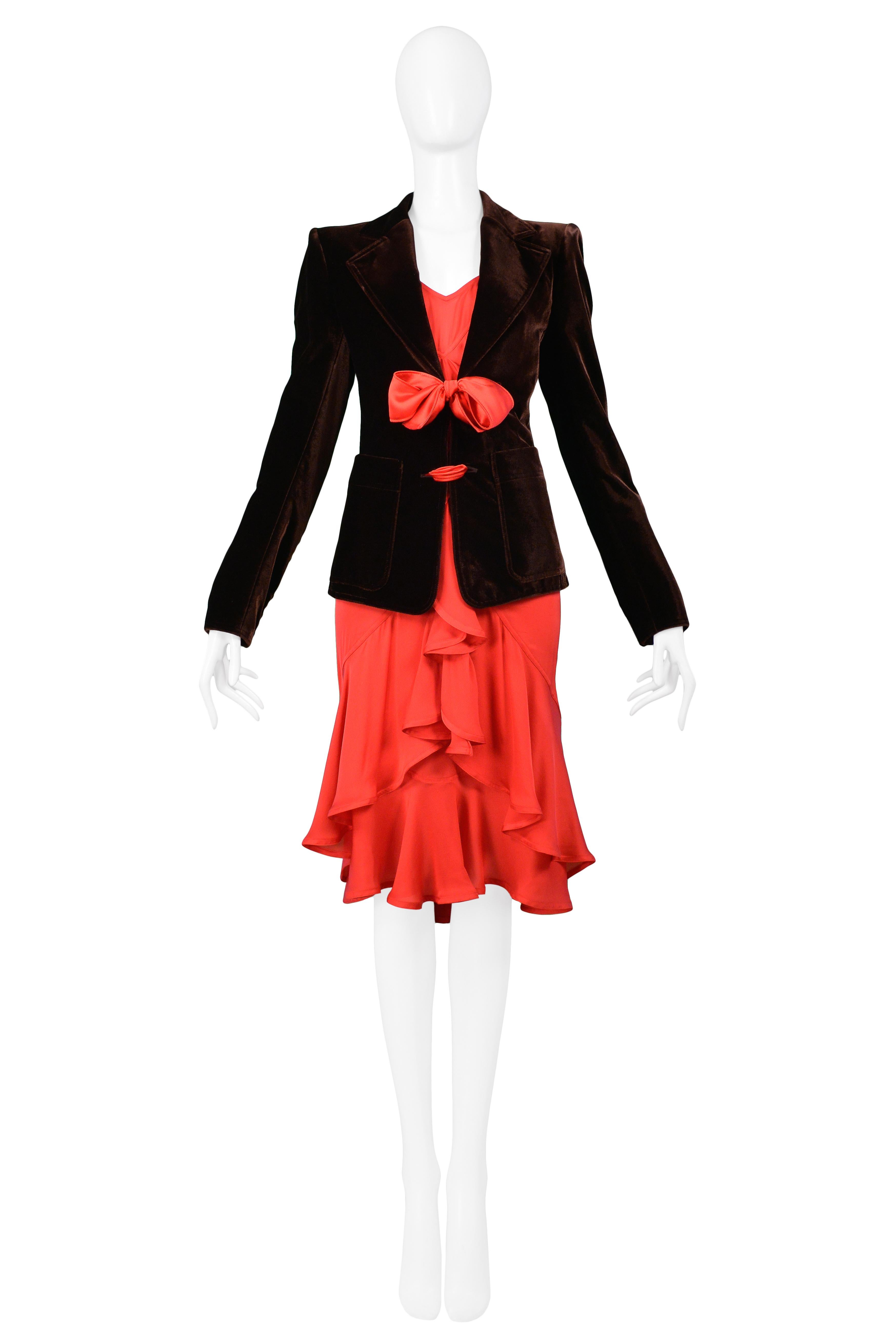 We are pleased to offer a vintage Tom Ford for Yves Saint Laurent brown velvet blazer and red cocktail dress ensemble. The classic velvet dinner jacket features a fitted body, patch pockets, and red sash tie front closure. The silk-like jersey dress