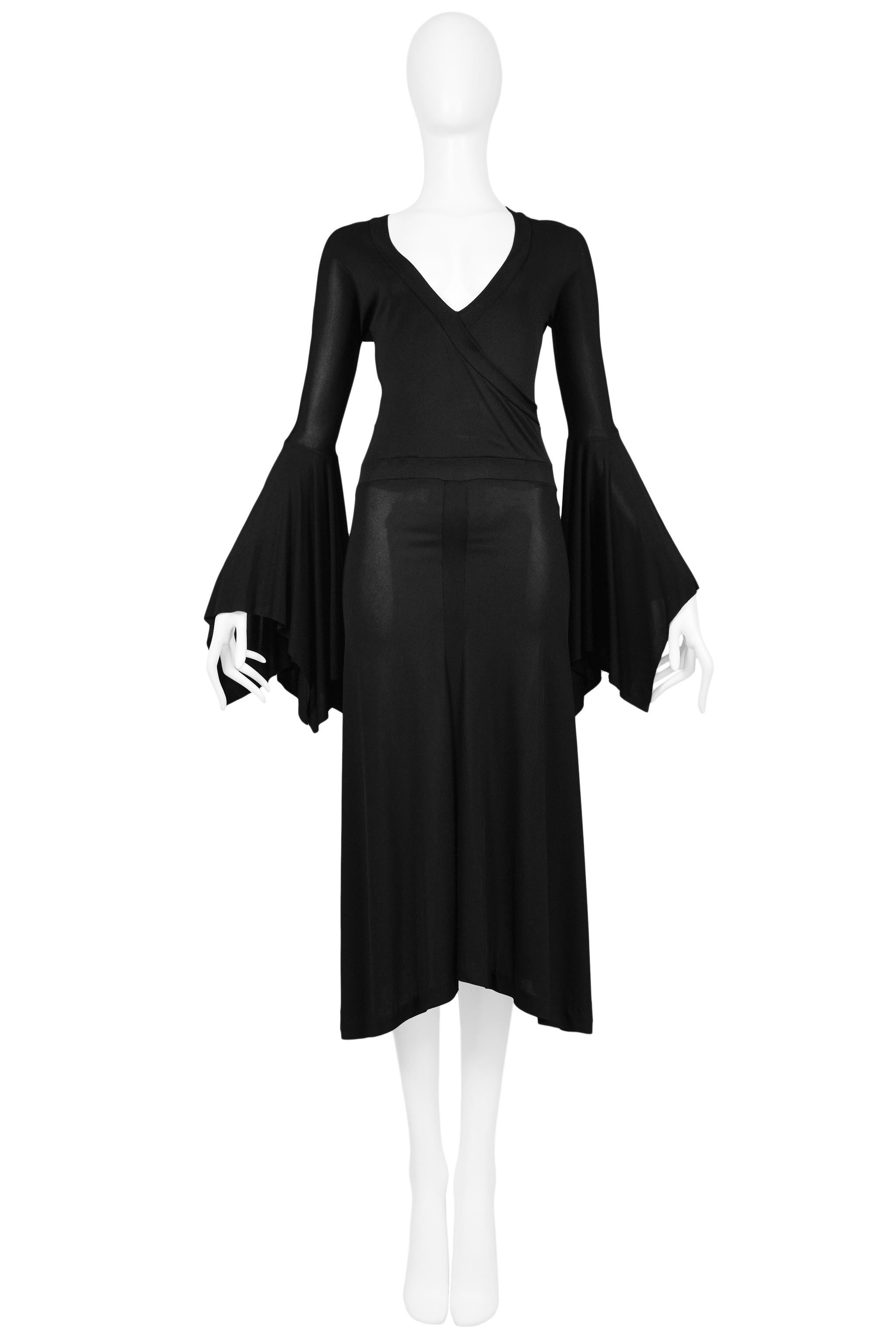 We are excited to offer a vintage Tom Ford for Yves Saint Laurent black jersey mid-length dress featuring bell sleeves and a v-neckline.

Yves Saint Laurent
Designed by Tom Ford
Size Medium
Bust 28