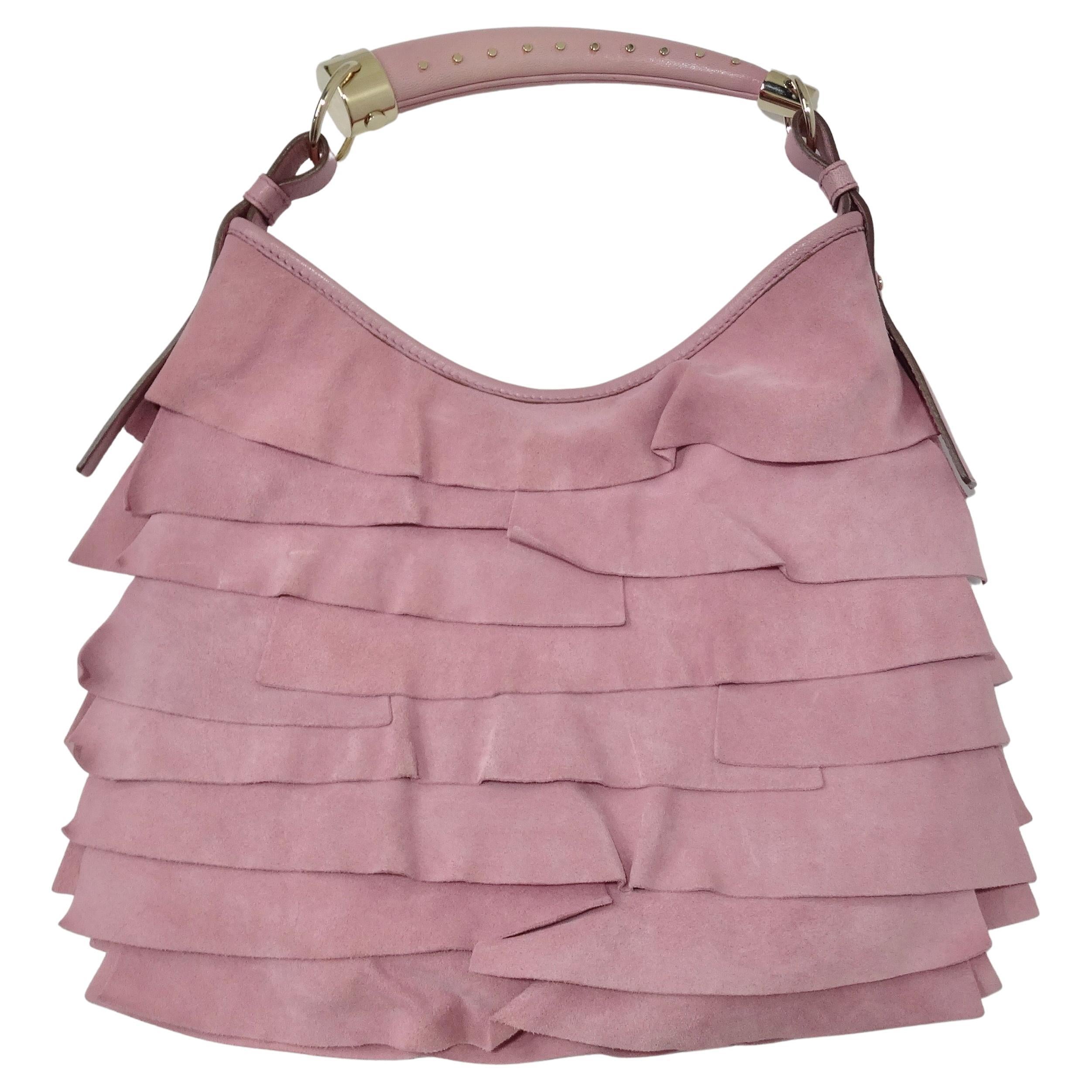 Wow! This vintage Tom Ford for Yves Saint Laurent pink Saint Tropez handbag is such a special find! Yves Saint Laurent presents their iconic Saint Tropez handbag in this super fun light bubble-gum pink shade. Circa early 2000's, this handbag