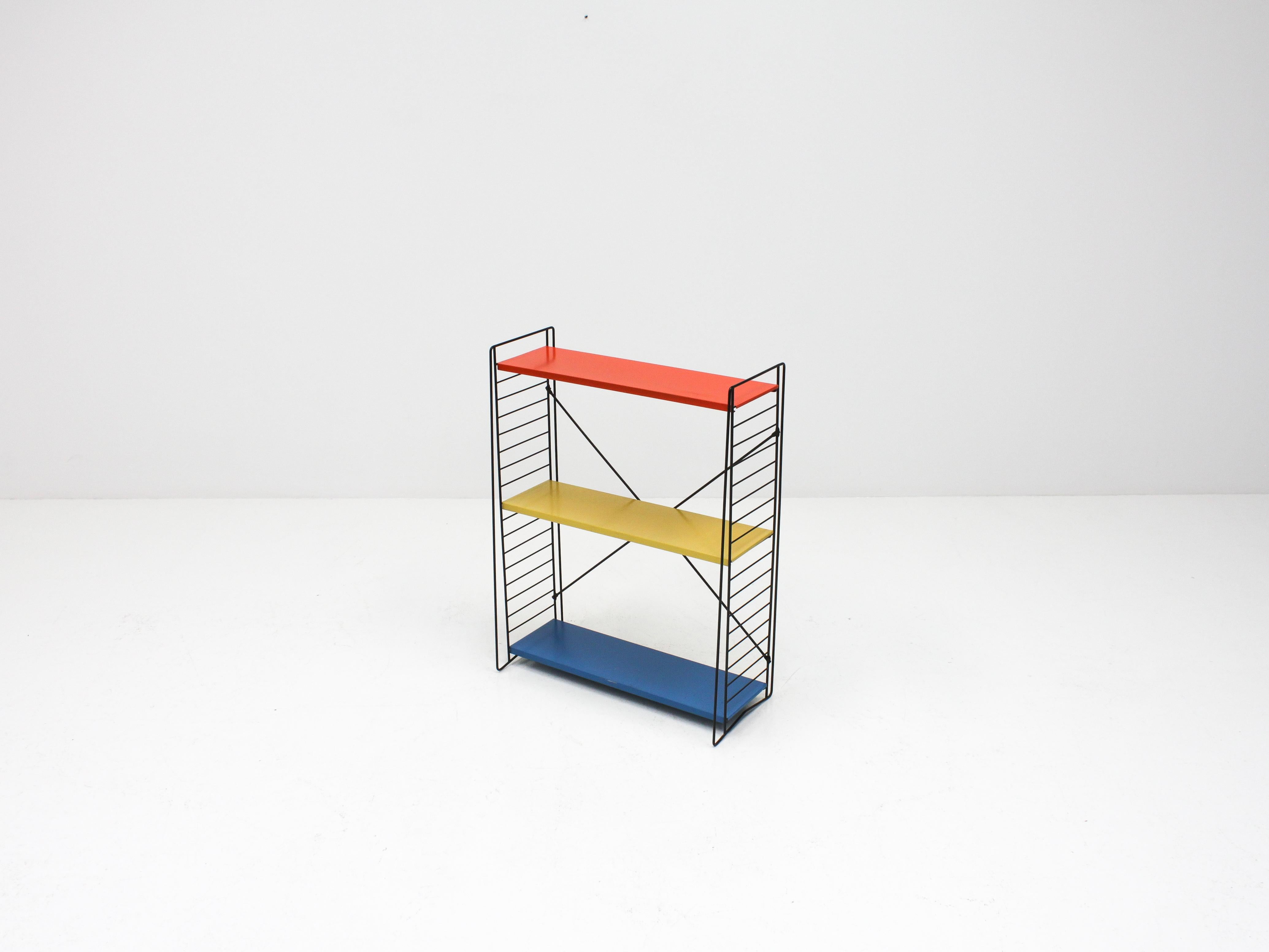 A set of vintage Tomado freestanding shelving/book racks, designed mid-1950s by A. Dekker and manufactured in the Netherlands.

Powder-coated frame and adjustable steel shelves. This design looks amazing in any room and location, the freestanding