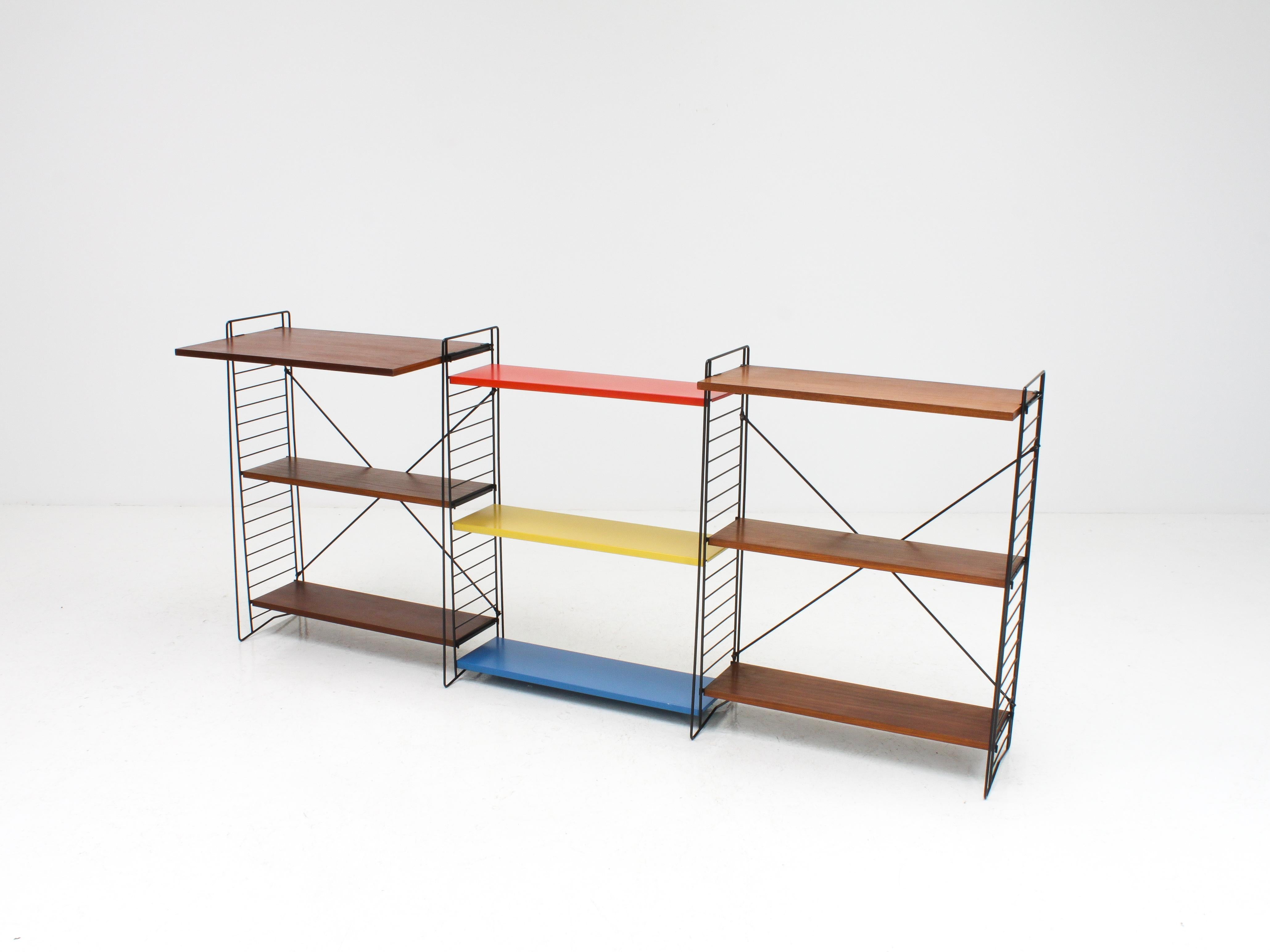 A set of vintage Tomado freestanding shelving / book racks with rare desk shelf - designed mid-1950s by A. Dekker and manufactured in the Netherlands.

Powder-coated frame and adjustable steel shelves. This design looks amazing in any room and