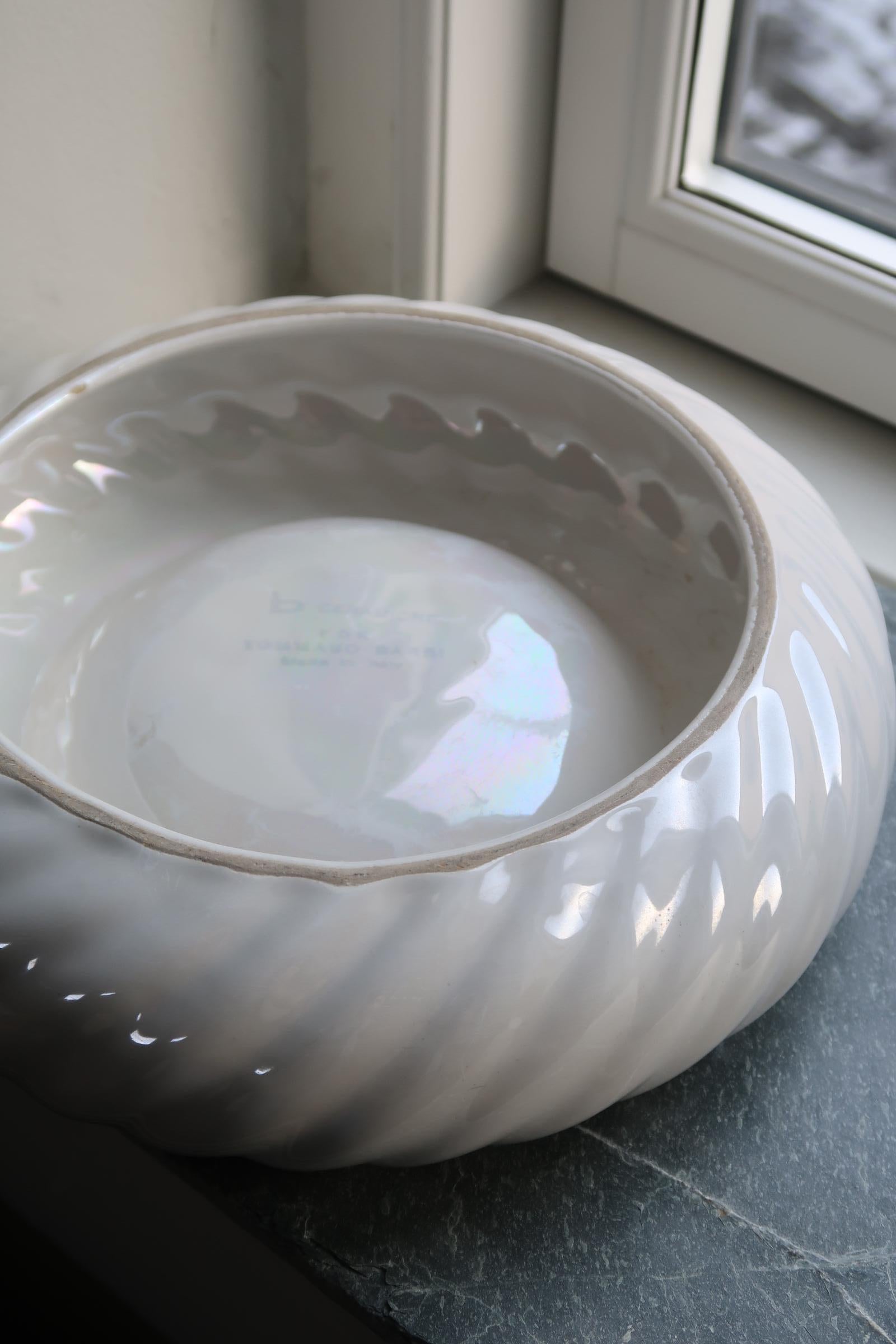 Original vintage Tommaso Barbi bowl in fluted ceramic. The bowl is handmade in Italy, 1970s, and signed on the bottom. Tommaso Barbi is a renowned Italian designer who, especially in the 1970s, designed whimsical and imaginative lamps and furniture.