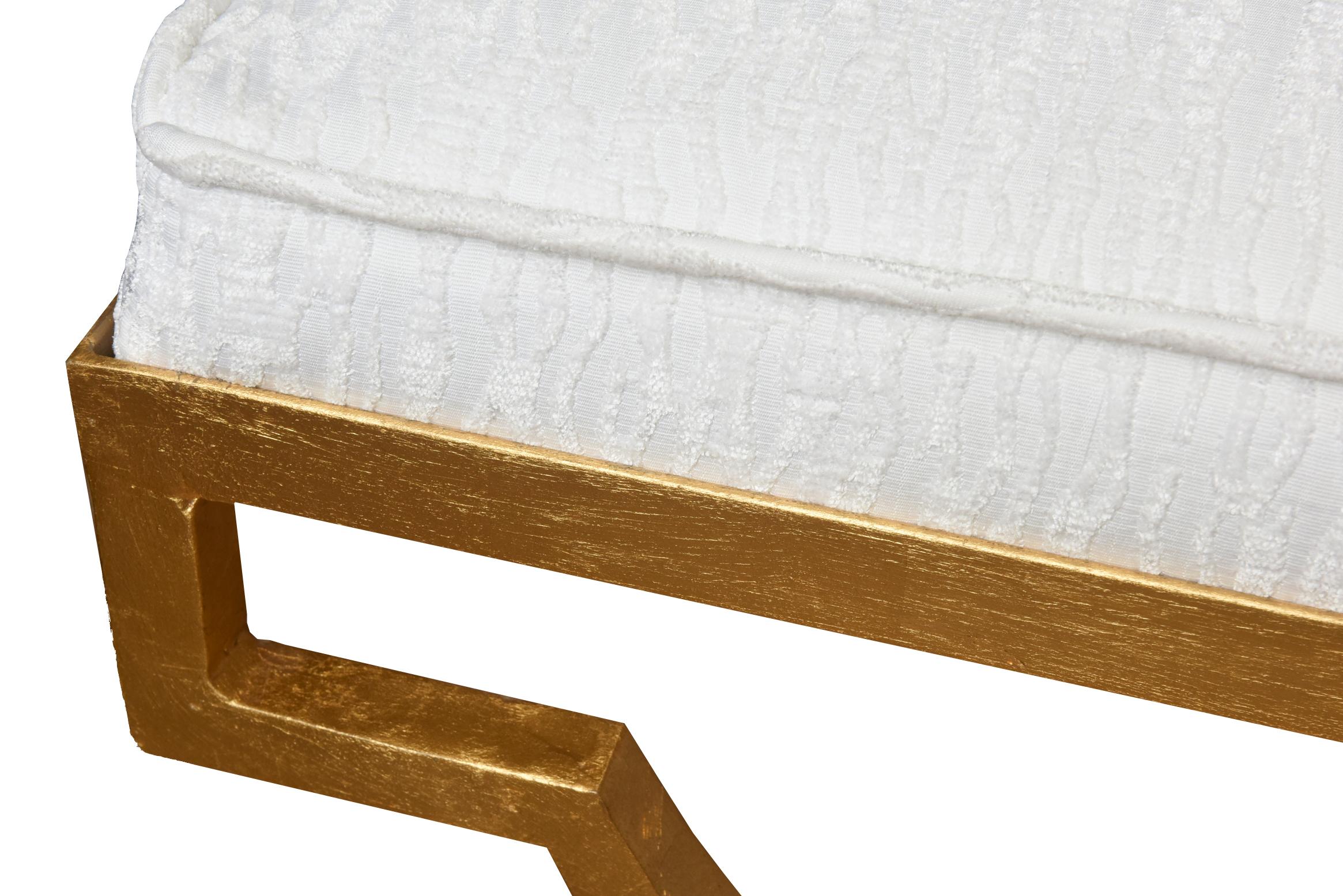 This vintage stunning Regency style Mid century modern vintage Tommi Parzinger bench is gold leaf over iron with wonderful newly upholstered seat in white cut velvet sculptural fabric with 3 large buttons on the top. It was completely restored