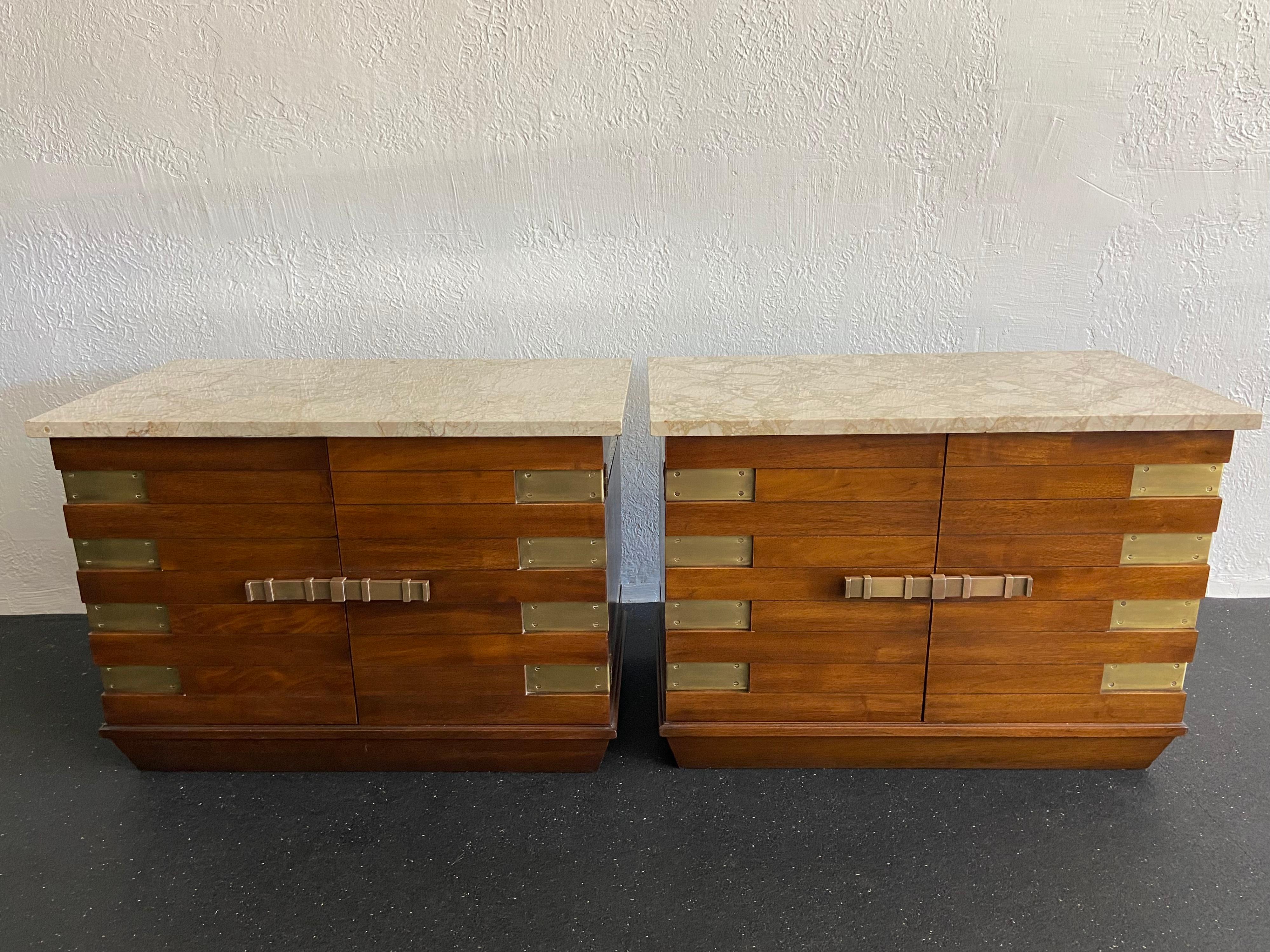 Tommi Parzinger style marble top chest by Heritage. Single shelf in each for storage. Little to no chipping on marble tops. Patina to the brass accents.

Would work well in a variety of interiors such as modern, mid century modern, Hollywood