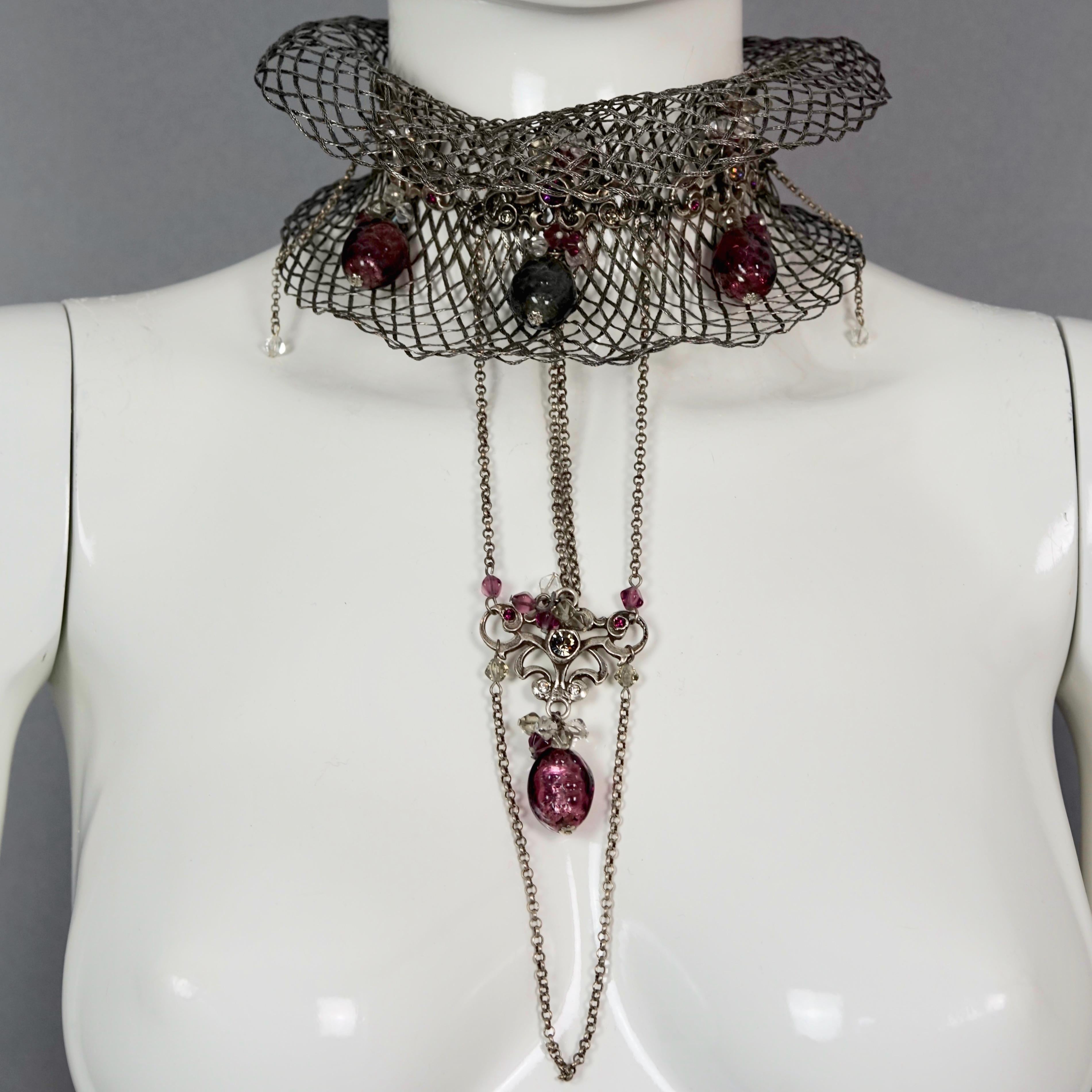 Vintage TON PASCAL Jewelled Baroque Mesh Cascading Chain Collar Choker Necklace

Measurements:
Height: 8.66 inches (22 cm)
Wearable Length: 12.60 inches (32 cm)
Depth: 2.36 inches (6 cm)

Features:
- 100% Authentic TON PASCAL.
- Baroque style mesh