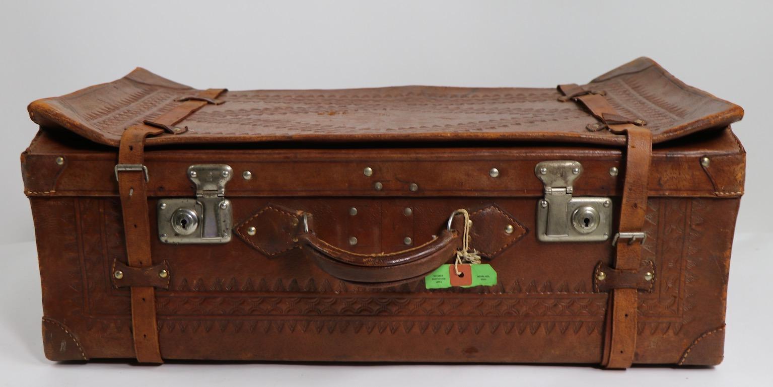 tooled leather suitcase