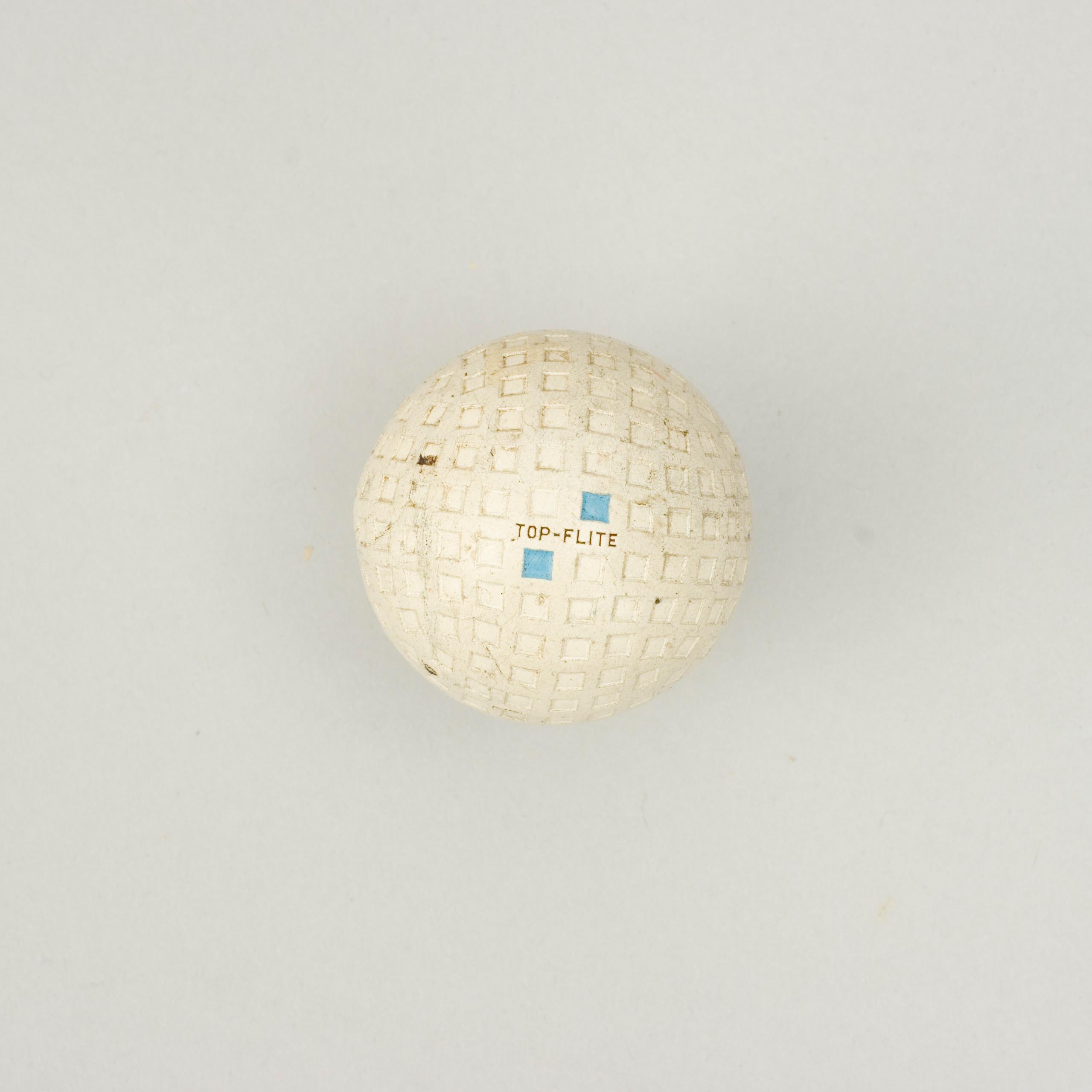 Vintage Spalding 'Top-Flite' Golf Ball.
A 1930's Spalding rubber core golf ball in very good condition. The ball has a square mesh or lattice pattern and is called 'Top-Flite'. The ball is marked 'Spalding' on one pole and 'Top-Flite' on the other