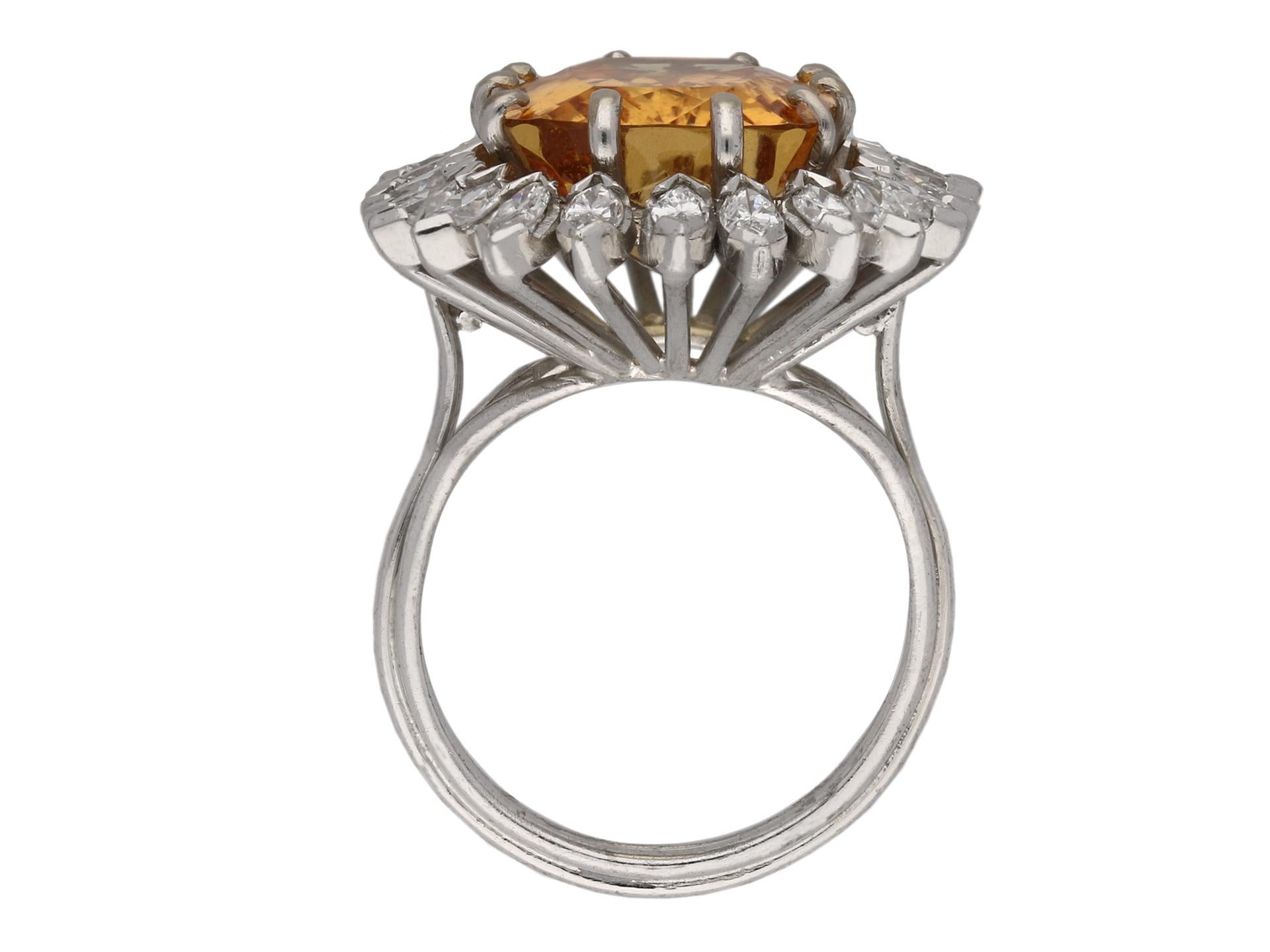 Topaz and marquise diamond coronet cluster ring. Set to the centre with a cushion shape scissor cut natural topaz in an open back claw setting with an approximate weight of 10.00 carats, encircled by a single row of twenty four outward pointed