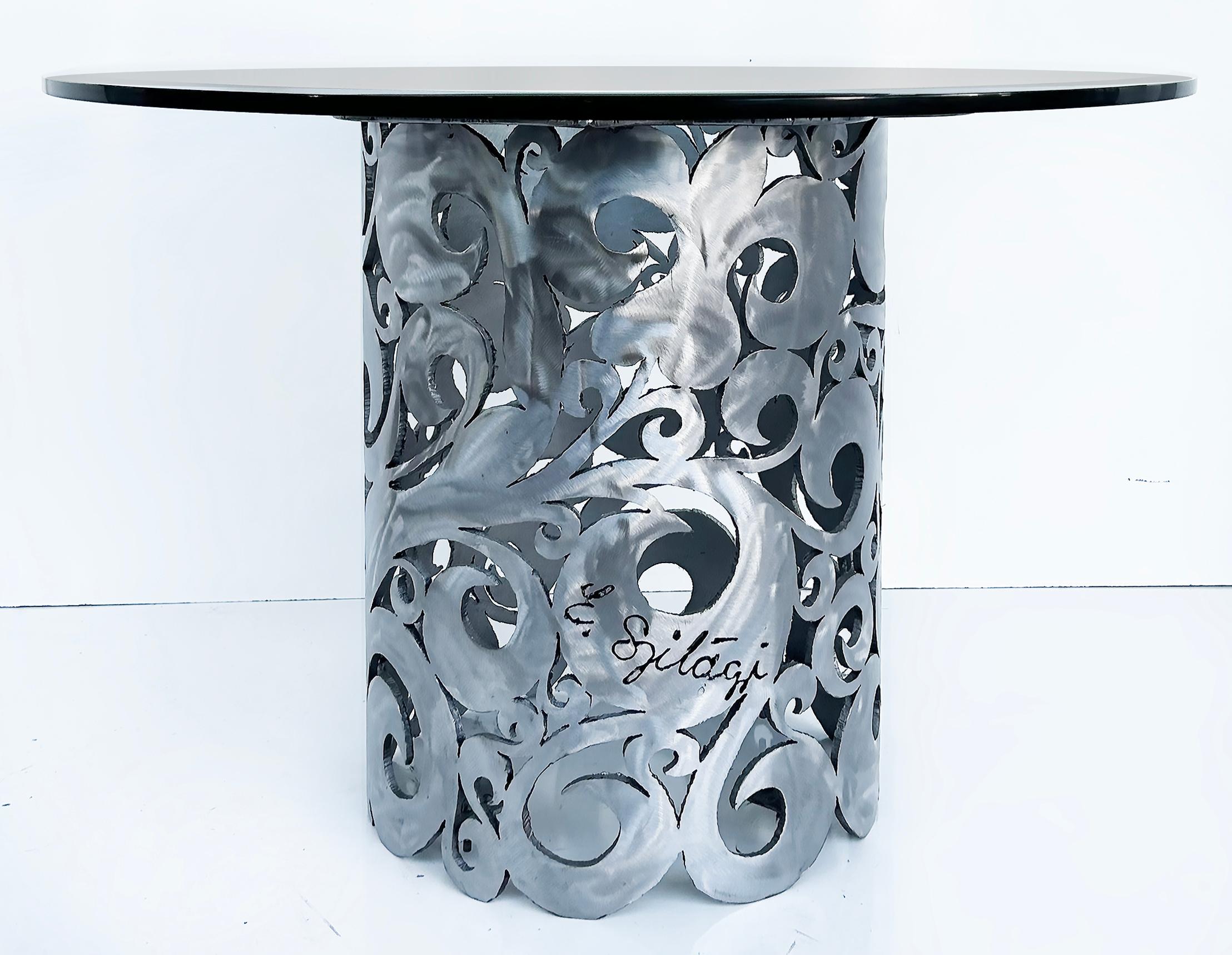 Vintage Torch Cut Brutalist Steel Table, Scrolling Floral Design, Artist signed 

Offered for sale is a vintage torch-cut brutalist steel center or dining table with a scrolling floral cut-out design. The table is topped with a thick beveled glass
