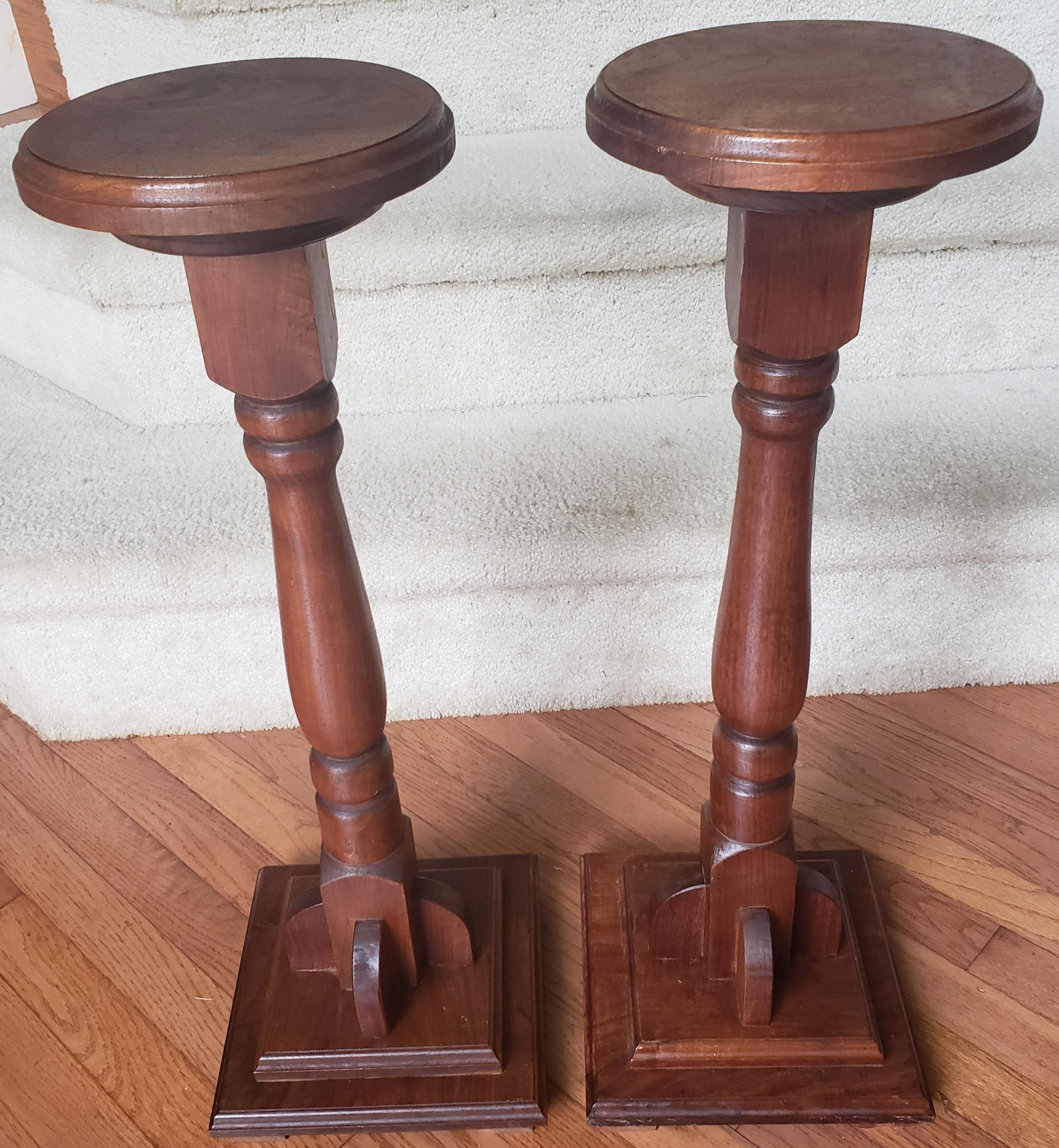 For your consideration is a pair of vintage torcheres in the Victorian taste, mahogany pedestal plant stand columns dating to the late 20th century. Attractive color and graining to the solid mahogany Of quality craftsmanship with a polished finish