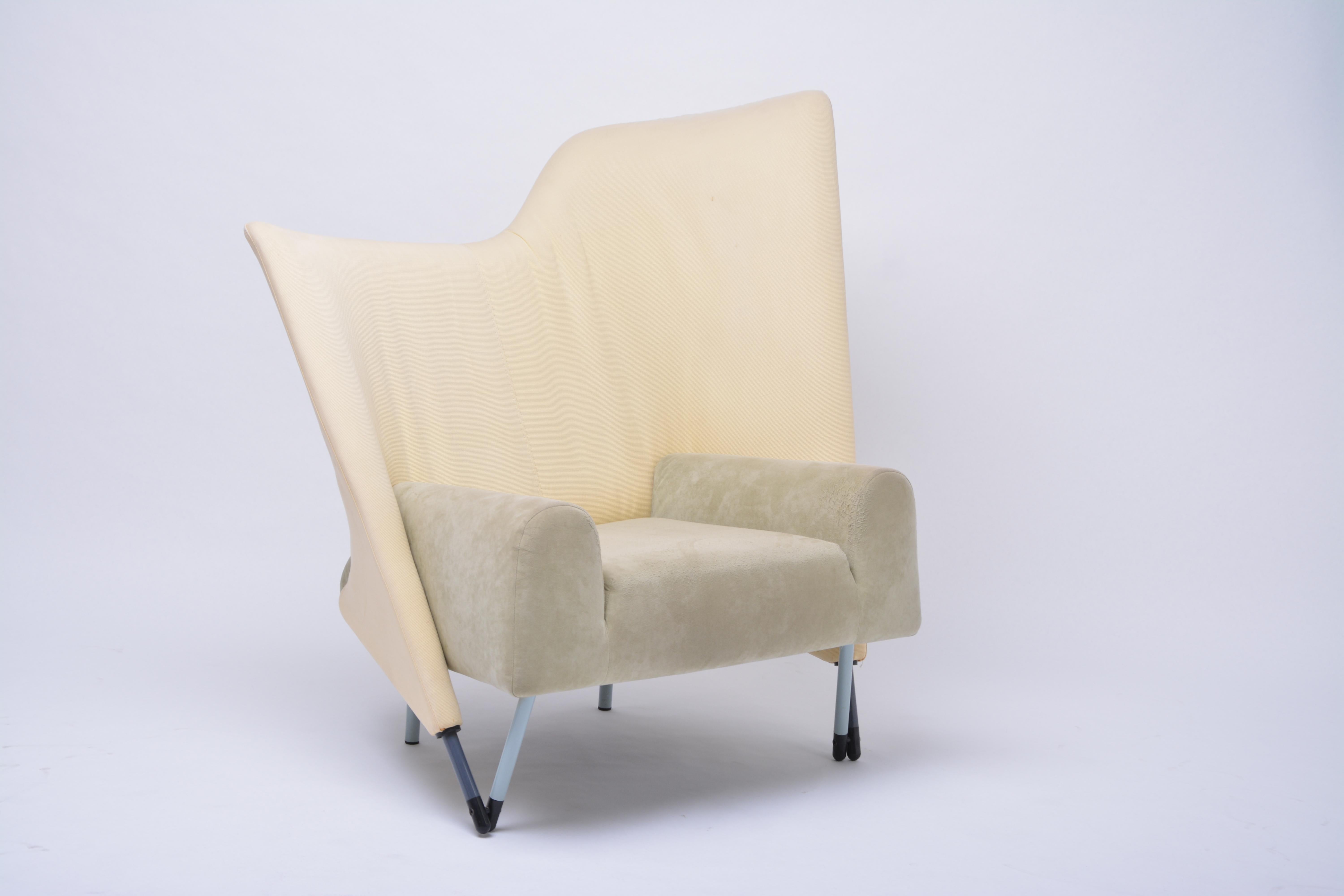 Spectacular Postmodern asymmetric armchair by Italian designer Paolo Deganello for Cassina in 1982. The chair is made of a steel skeletal frame, padded with CFC-free polyurethane foam and polyester padding. Upholstered in two different fabrics.