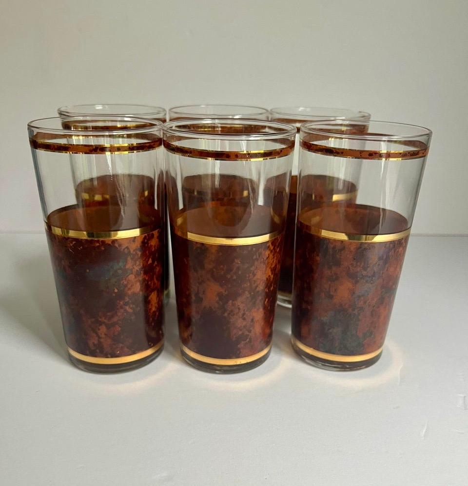 Beautiful set of 6 vintage glasses in like new condition 
Tortoise finish with a gold ring.
No maker’s marking but they looks very similar to Culver glasses 
This set is beautiful to add to a Bart cart or to give some glam to your bar area 