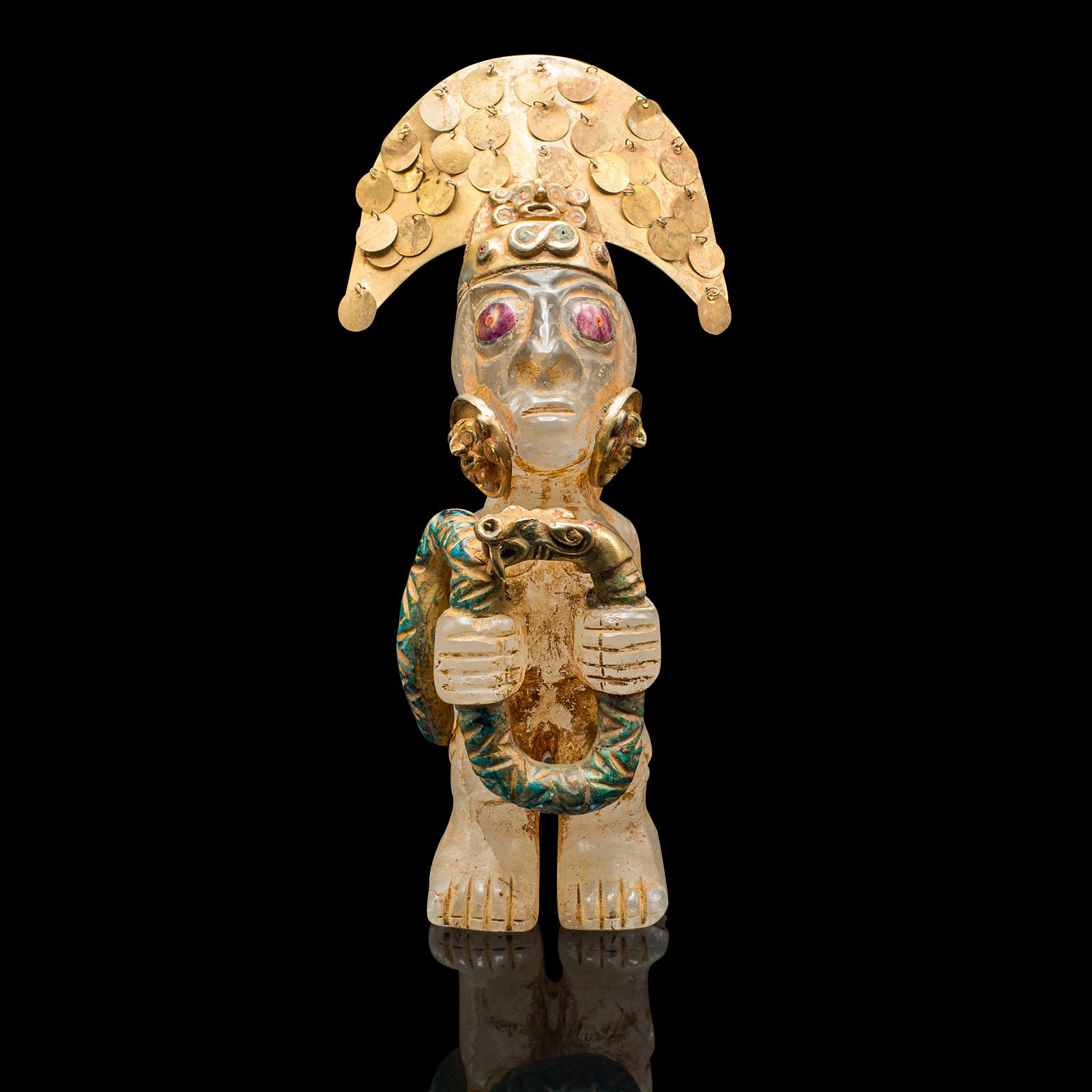 
This is a vintage totemic figure. A South American, carved crystal and gilt metal decorative tribal ornament, dating to the mid 20th century, circa 1950.

Fascinating tribal figure in the Inca or Pre-Columbian manner
Displaying a desirable aged