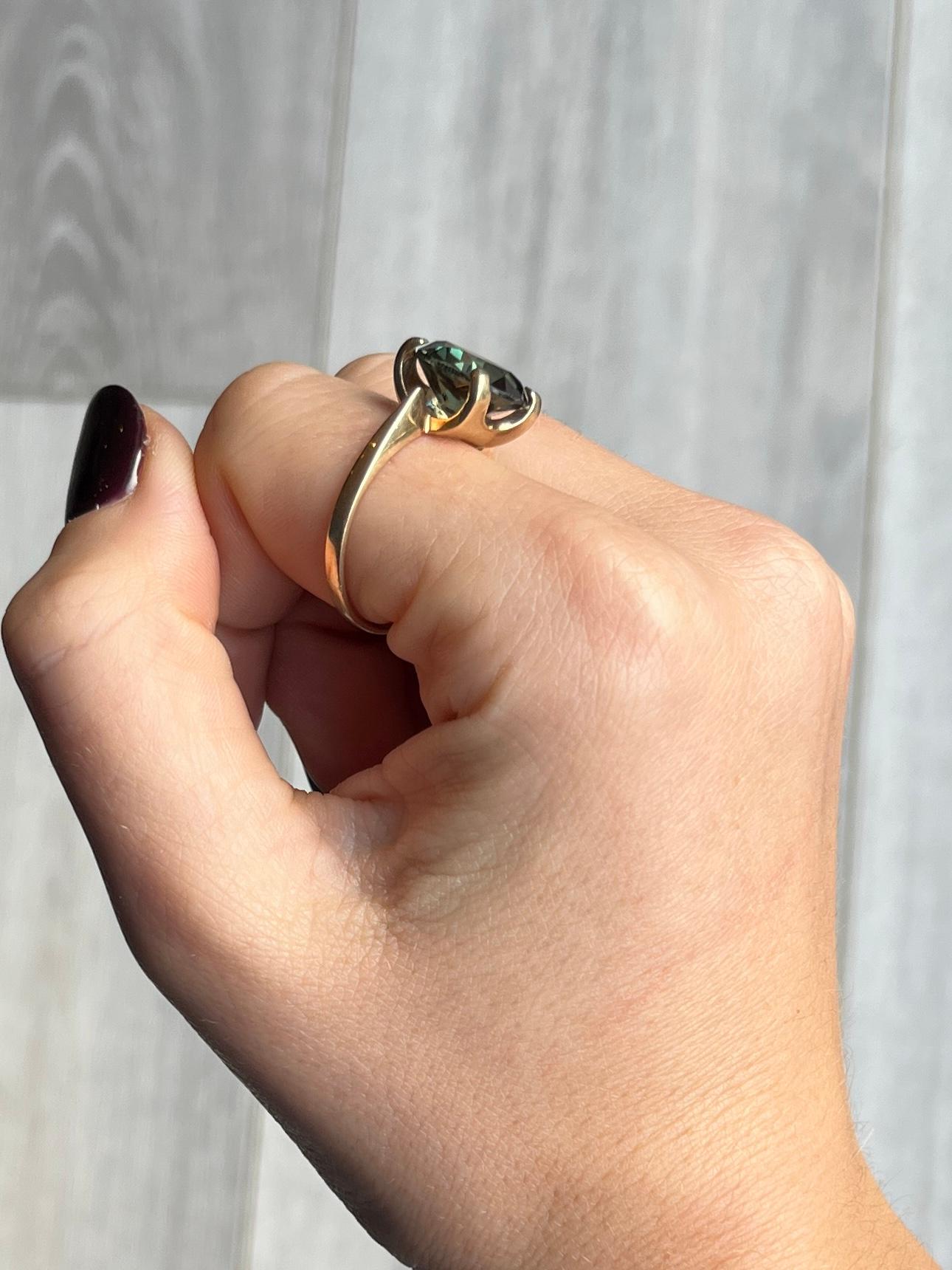 The gorgeous deep green tourmaline stone is set within four claws and measures 6carat. The ring is modelled in 9carat gold. 

Ring Size: T 1/2 or 9 3/4 
Ston diameter: 12mm

Weight: 5g
