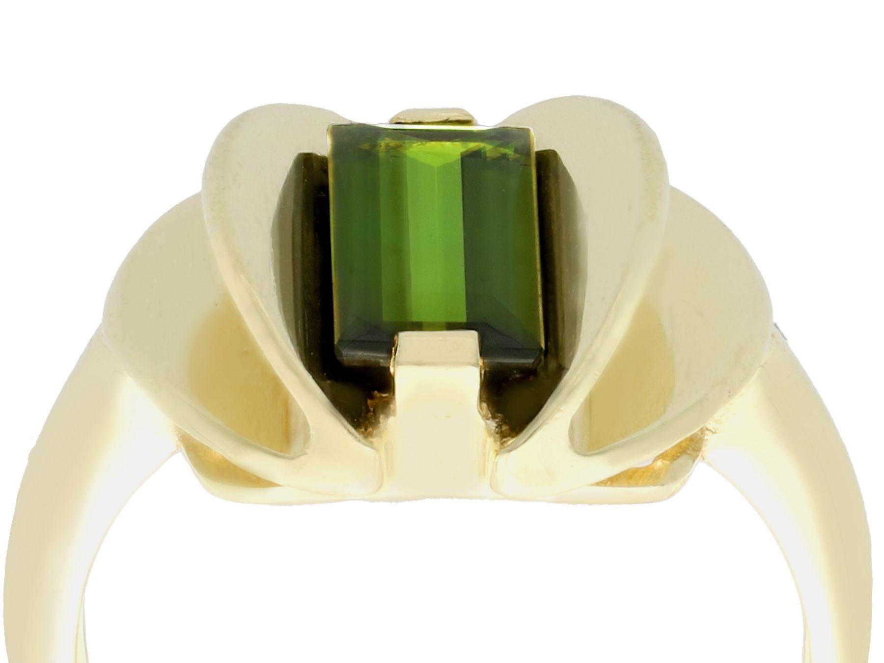An impressive vintage Art Deco 2.05 carat green tourmaline and 14 karat yellow gold dress ring; part of our diverse gemstone jewelry collections.

This fine and impressive vintage tourmaline ring has been crafted in 14k yellow gold.

The three