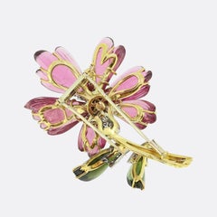 Broche fleur vintage en tourmaline, émeraude et diamants