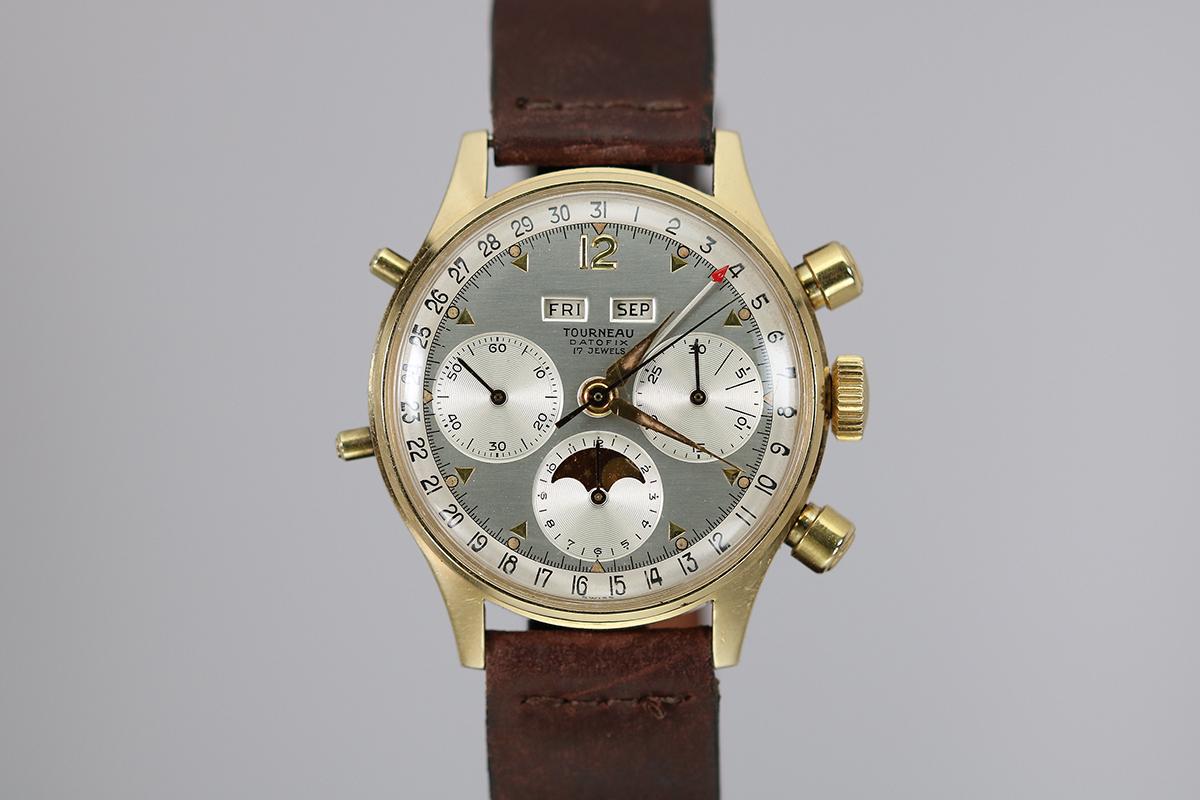 This is a very complicated and rare 1950's watch at a very affordable price. This Tourneau wrist watch is made of solid 14kt yellow gold. The watch has a chronograph and triple date functions. The original silver dial is pristine. The case is super