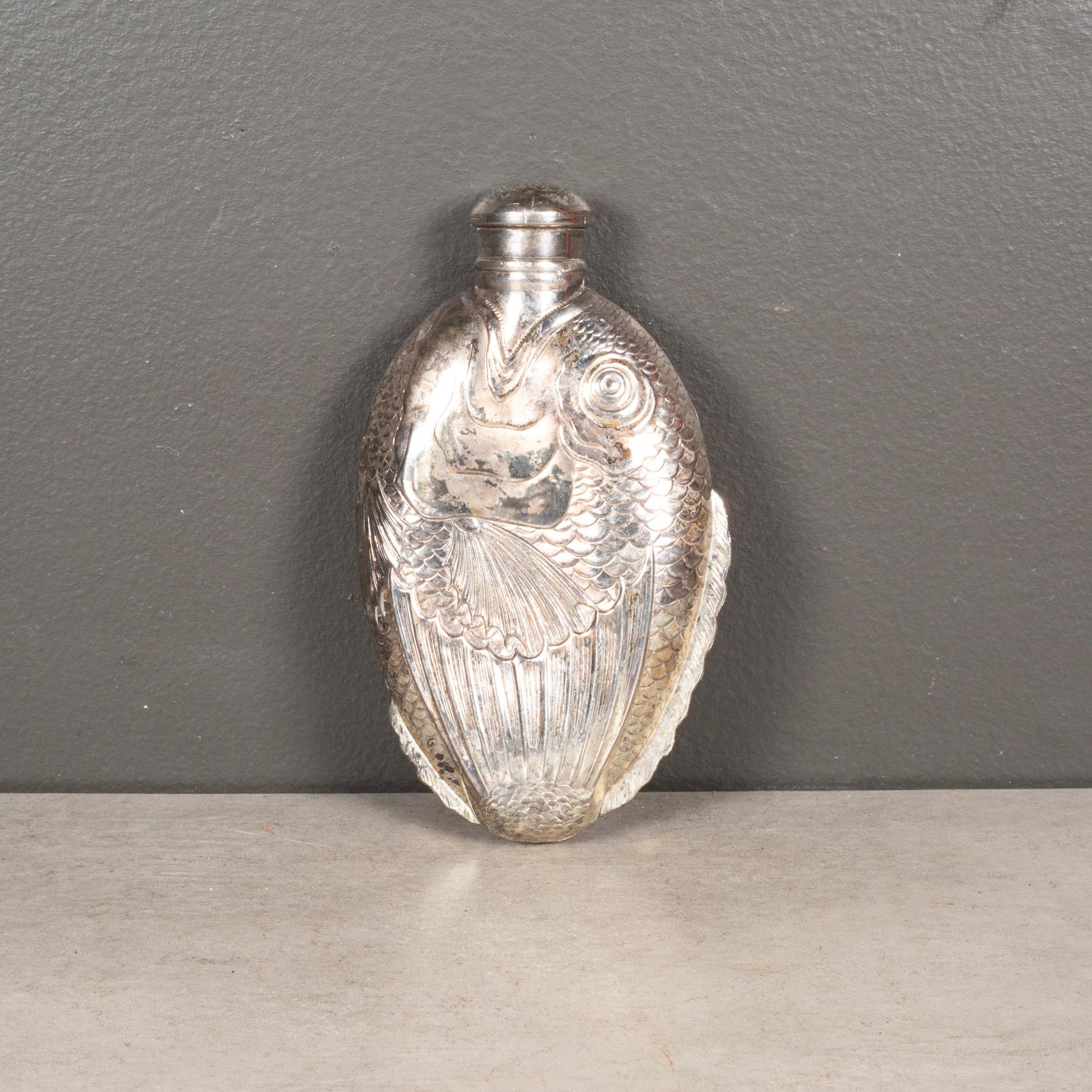 ABOUT

A vintage, silver plated fish flask shaped like a Piranha with screw top lid. Monogrammed on top of the lid. Stamped 