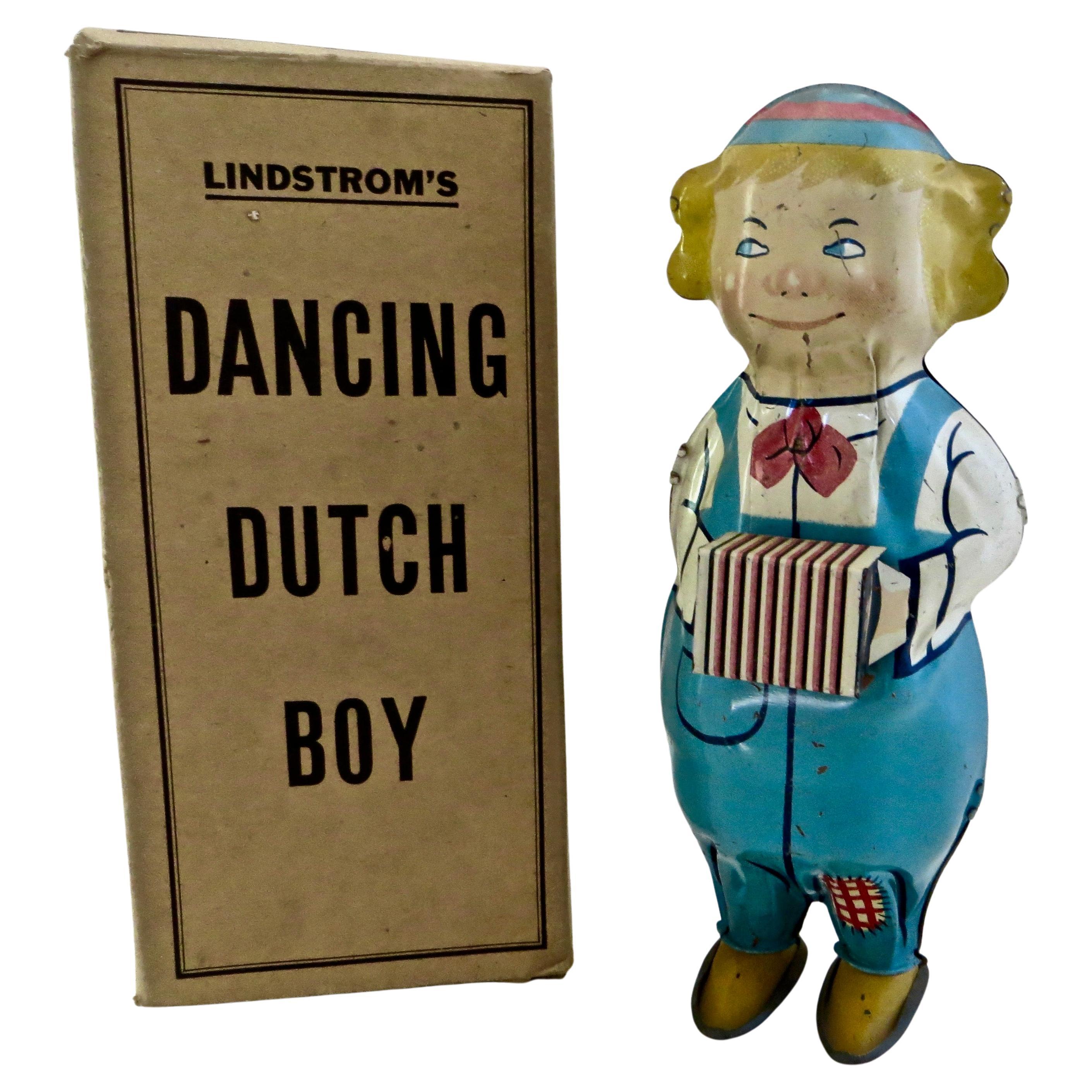 Vintage-Spielzeug von Lindstrom, tanzender niederländischer Junge, der Akkordeon spielt, amerikanisch, um 1930 im Angebot