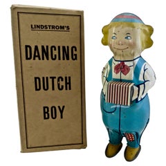 Jouet vintage Lindstrom - Jeu de danse hollandais - garçon jouant de l'accordéon - Américain - vers 1930