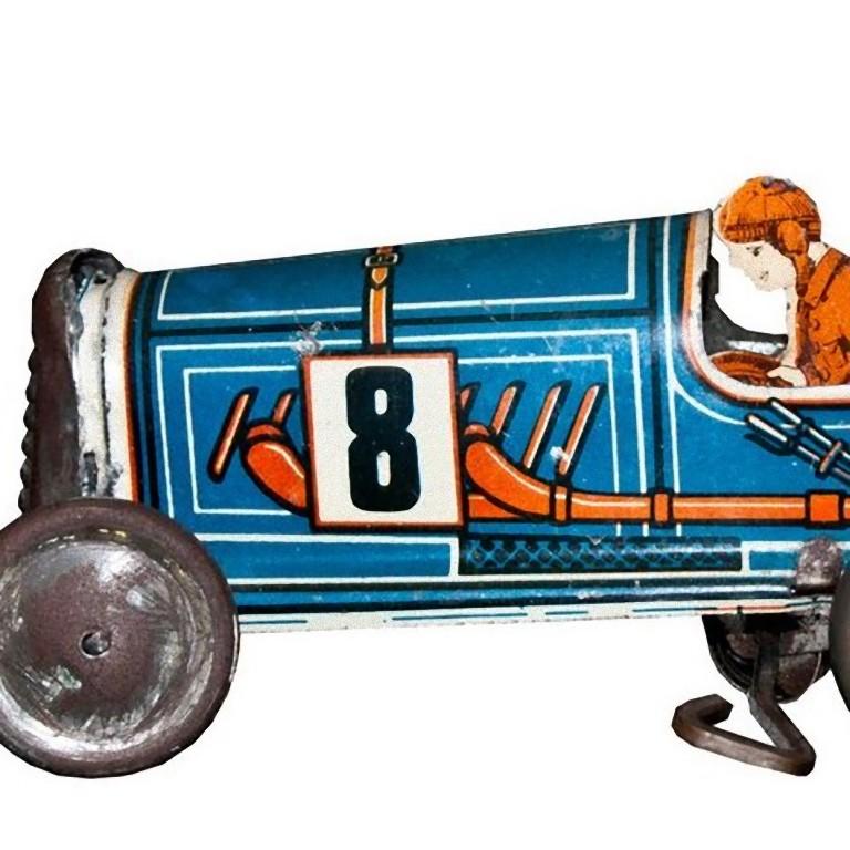 This Wind up Memo 708 car is a midcentury mechanical toy.

Vintage wind up mechanical toy boat tail race car. Includes the cutout of the driver.

Made in France by Memo, model n. 708. 

Clockwork in good conditions as well as painting. One of