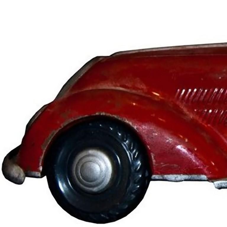 This Wind up big size car is a mechanical toy sports car, nicely detailed.

The original clockwork works, even though a bit slowly.
Original key not included.
Unknown manifacturer and year.
Good overall conditions.

This object is shipped