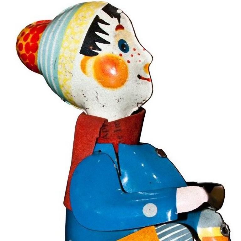 This wind up boy on tricycle is a vintage mechanical toy.

Vintage wind up mechanical toy representing a boy riding his tricycle.

Made in Germany in 1930s. Made in lithographed tin.

Original key included.

Clockwork works well and the pain