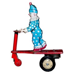 Vintage Toy, Wind Up Clown on Scooter, 1950s 